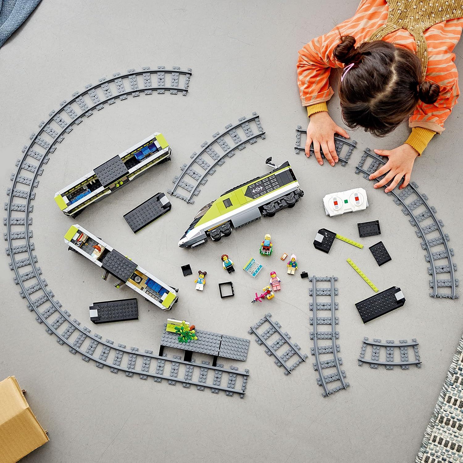 Shows all the pieces and components included in the LEGO train set, helping shoppers understand the complete contents and value of the kit.