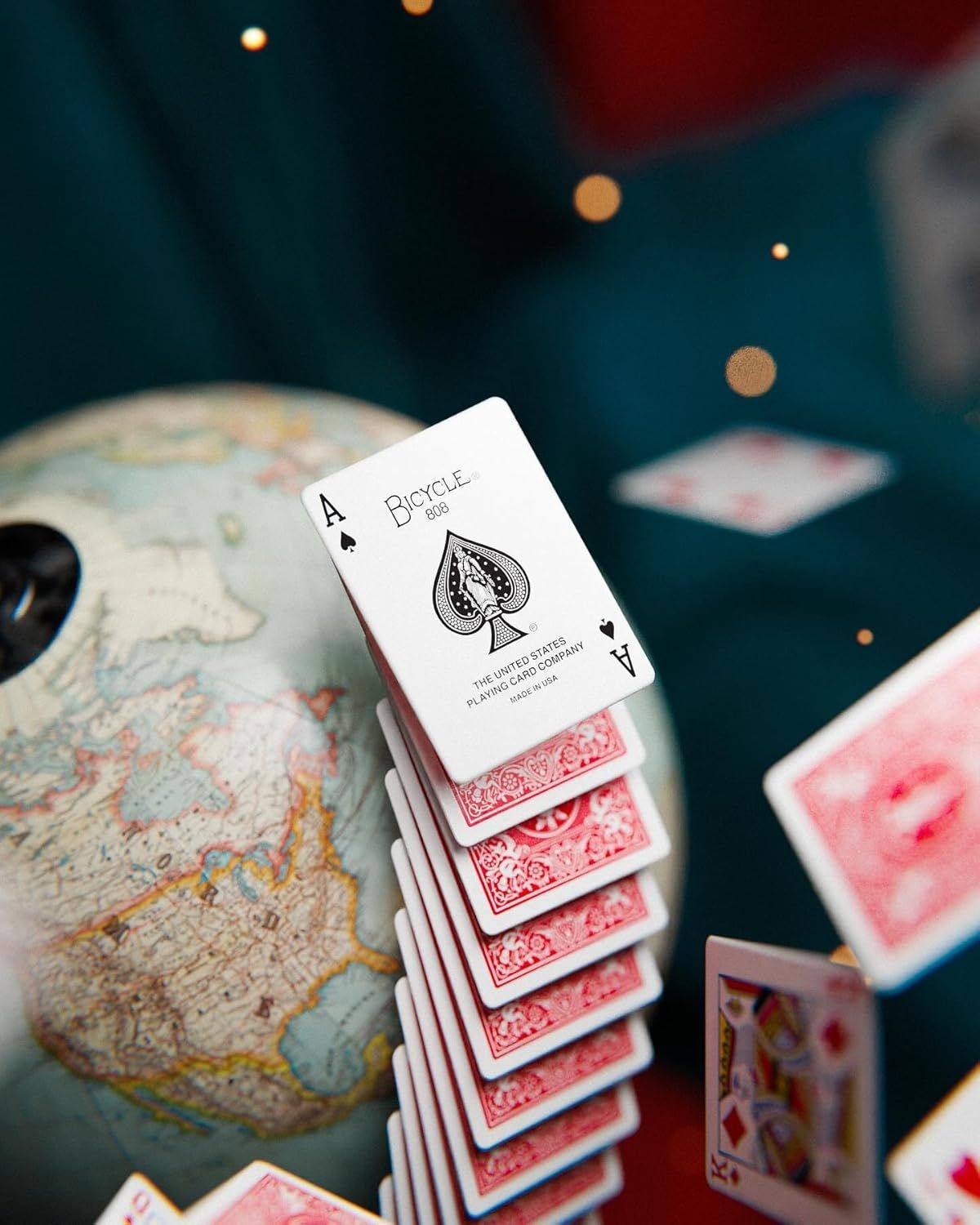 Shows the playing cards in a real-world gaming environment to help shoppers visualize the product in use and create an aspirational, atmospheric connection.