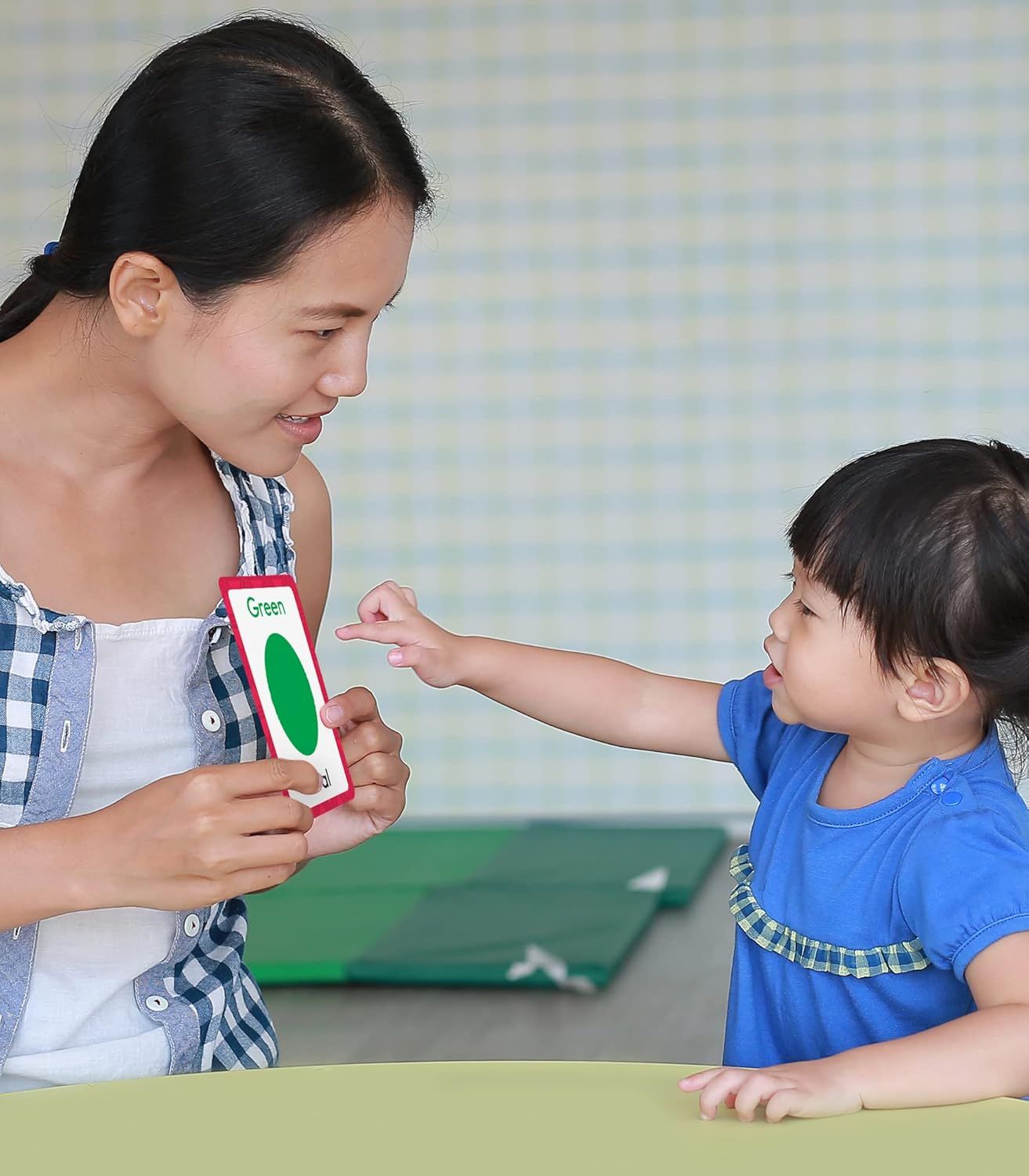 Demonstrates the product being used in a real-world educational setting with a parent and child, showing natural interaction and engagement to help shoppers visualize the product in use.