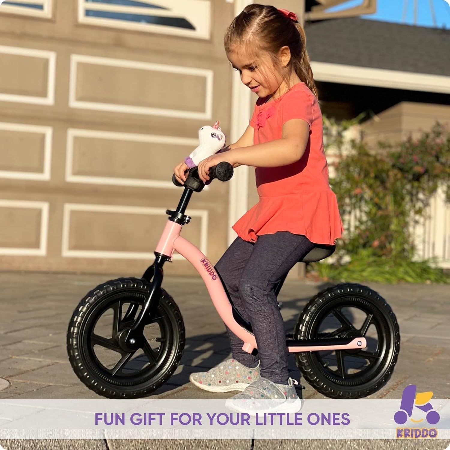 Positions the balance bike as a fun gift option for young children, appealing to parents and gift-givers looking for age-appropriate presents. Shows a real-world use case of a young girl enjoying…