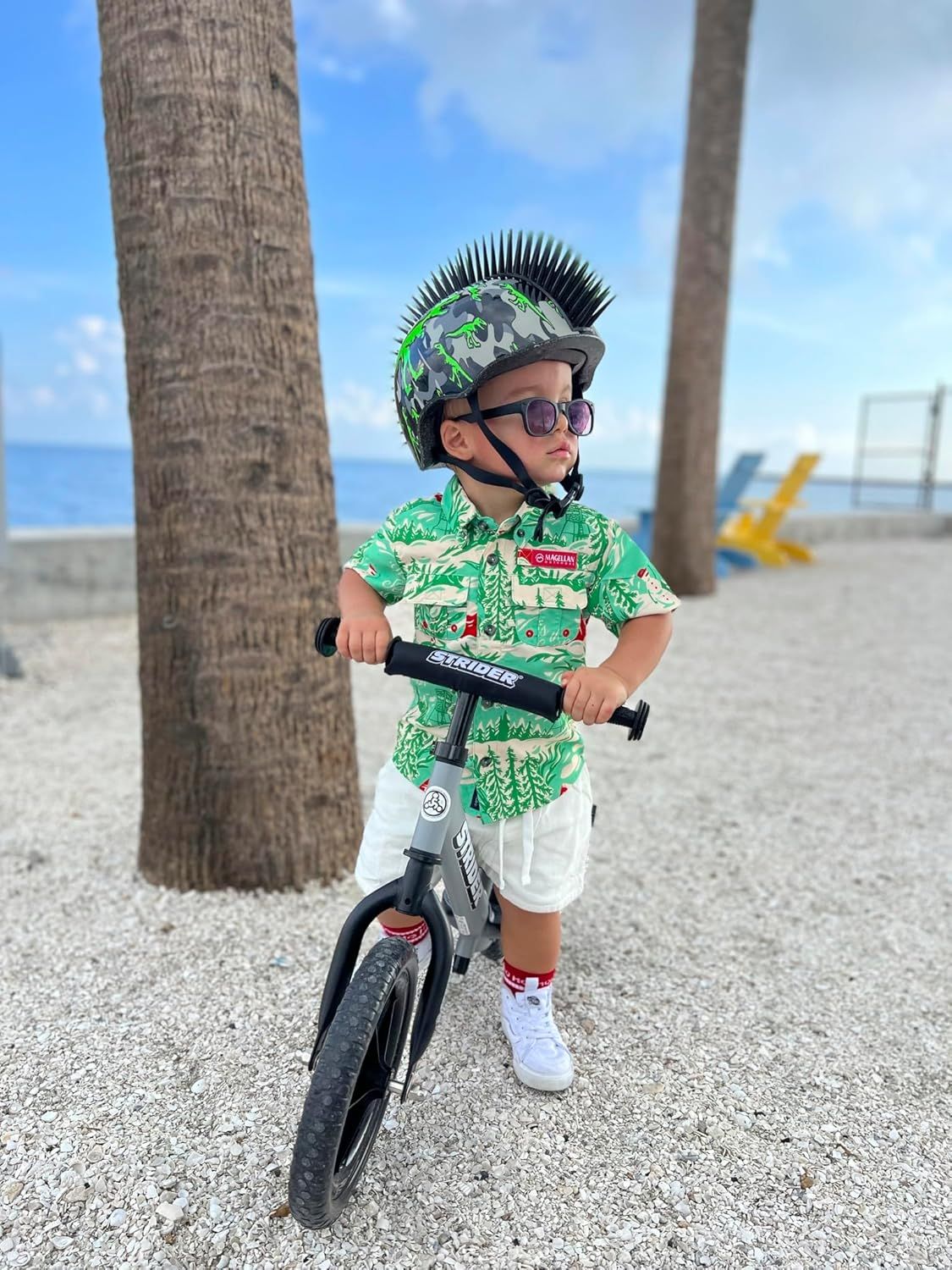 Demonstrates the product in a real-world outdoor environment to help shoppers visualize the bike being used by a child in an active, lifestyle context.