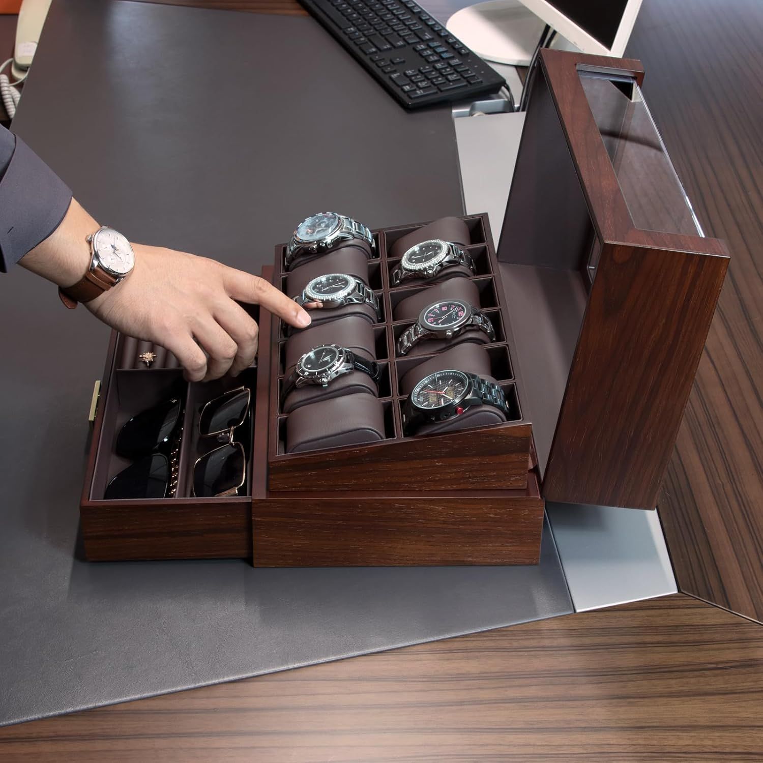 Demonstrates the product in a real-world office setting, showing how it elegantly stores and displays watches and accessories on a desk, appealing to shoppers seeking sophisticated organization…