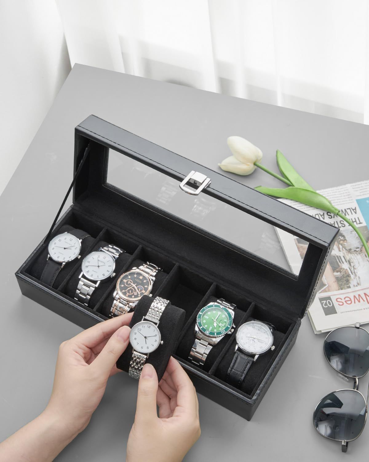 Shows the customer what they receive with their purchase—a premium watch storage case with organized compartments for multiple watches, emphasizing the product's organizational and protective…