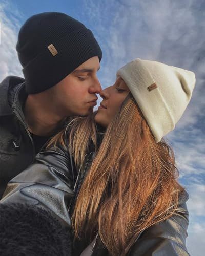 Showcases the product (beanies) in a real-world outdoor lifestyle context to help shoppers visualize themselves using the product in everyday moments.