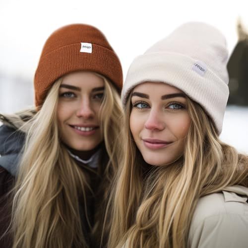 Demonstrates the product (beanies) being worn in a natural, real-world winter environment to help shoppers visualize themselves using the product.