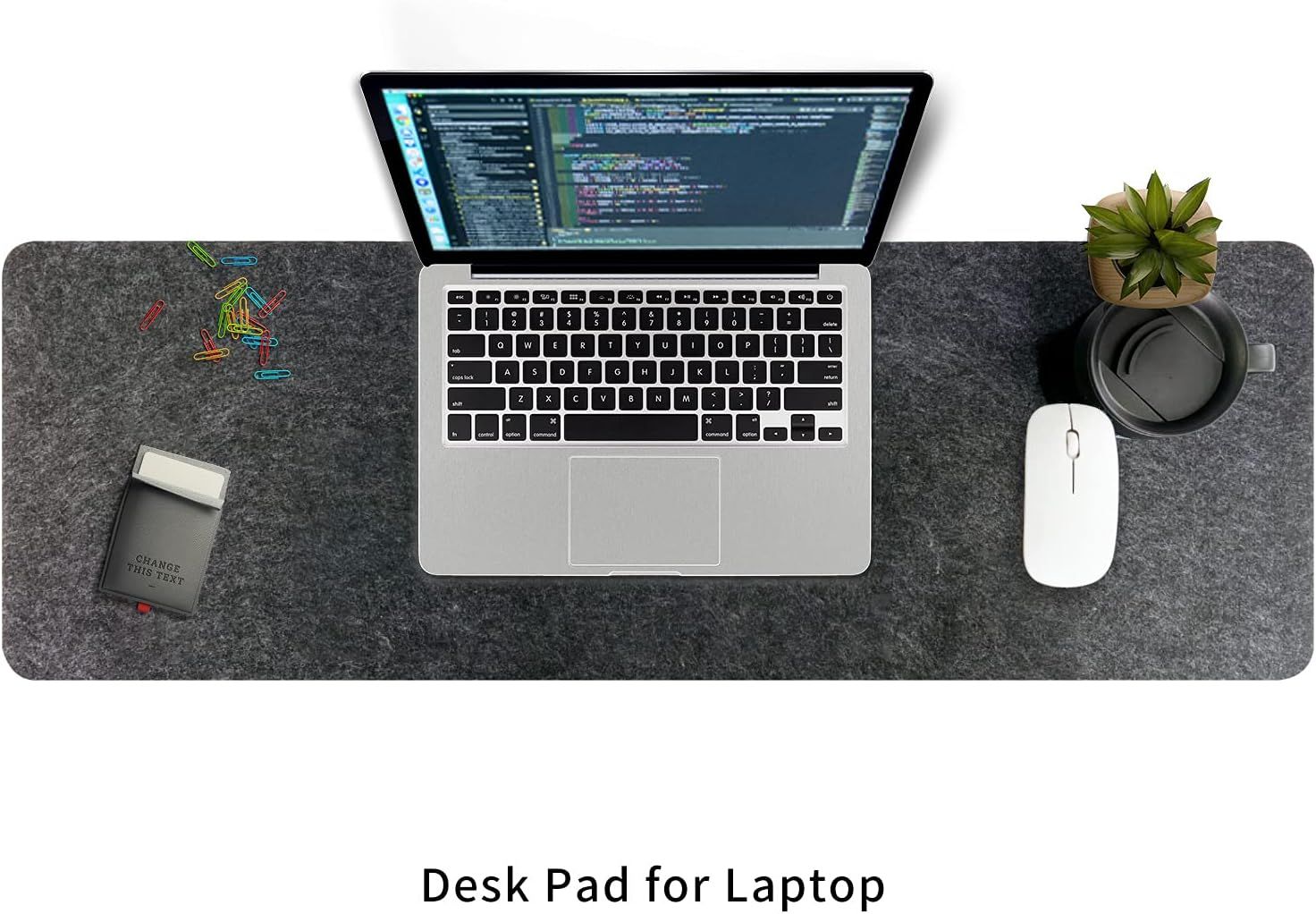 Demonstrates the product in a real-world workspace setting, showing how the desk pad fits naturally into a professional environment with a laptop, mouse, and office accessories.