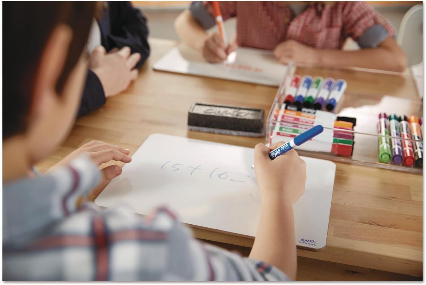 Demonstrates the product being used in an authentic classroom or home learning environment to help shoppers visualize the markers in everyday use.