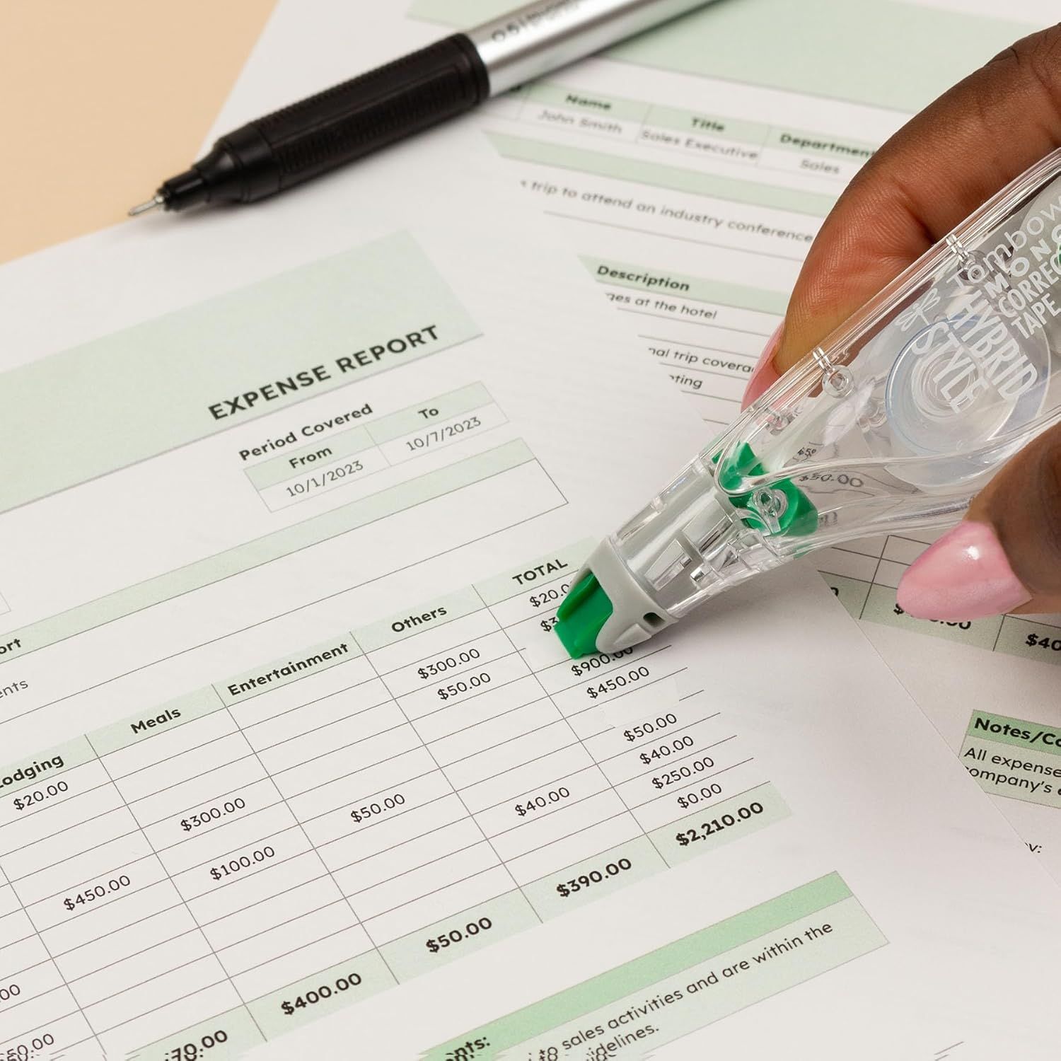 Demonstrates the product in a real-world office use case, showing how the correction tape is used for fixing errors on expense reports and business documents.