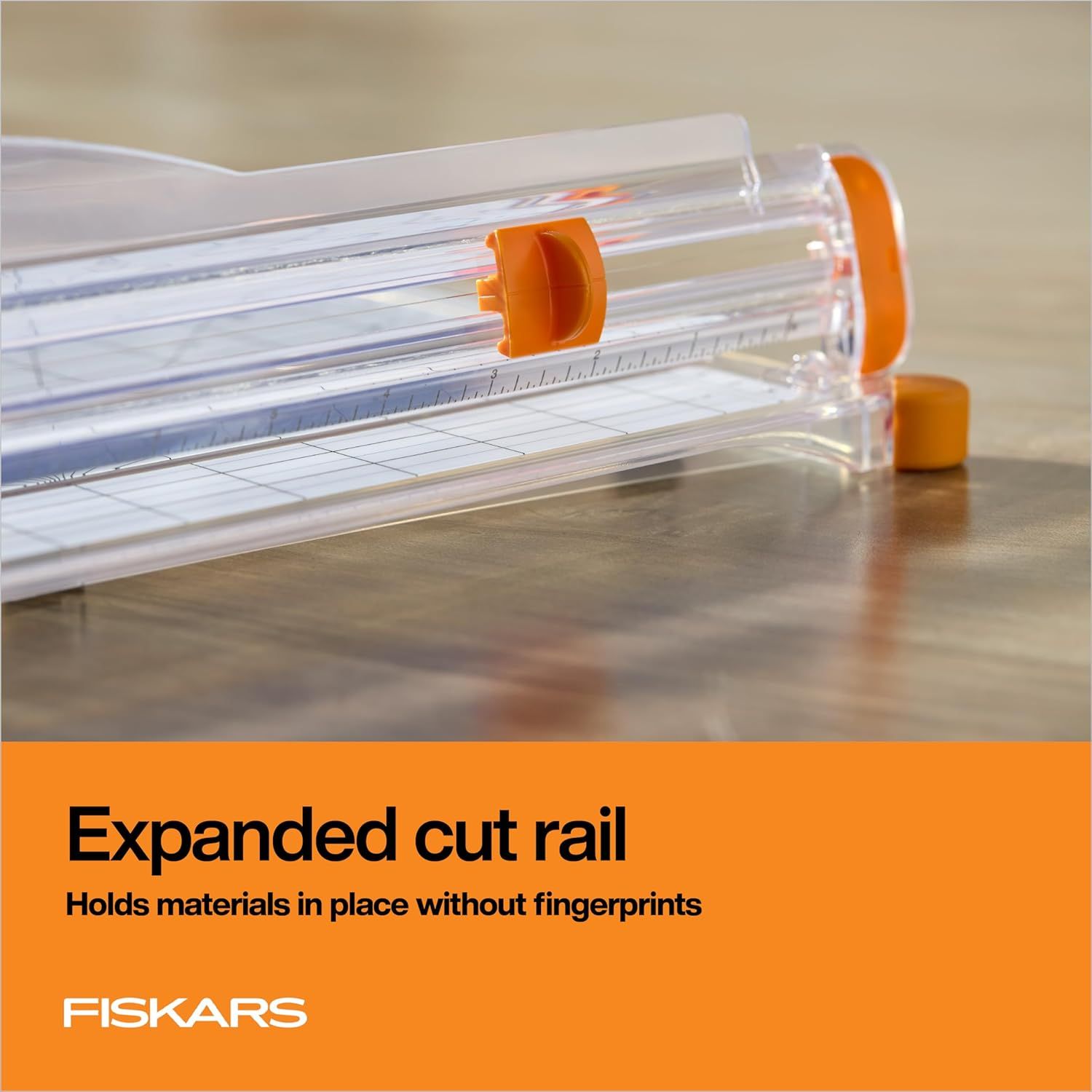 Highlights the expanded cut rail feature that holds materials securely in place without leaving fingerprints, emphasizing clean handling and precision.