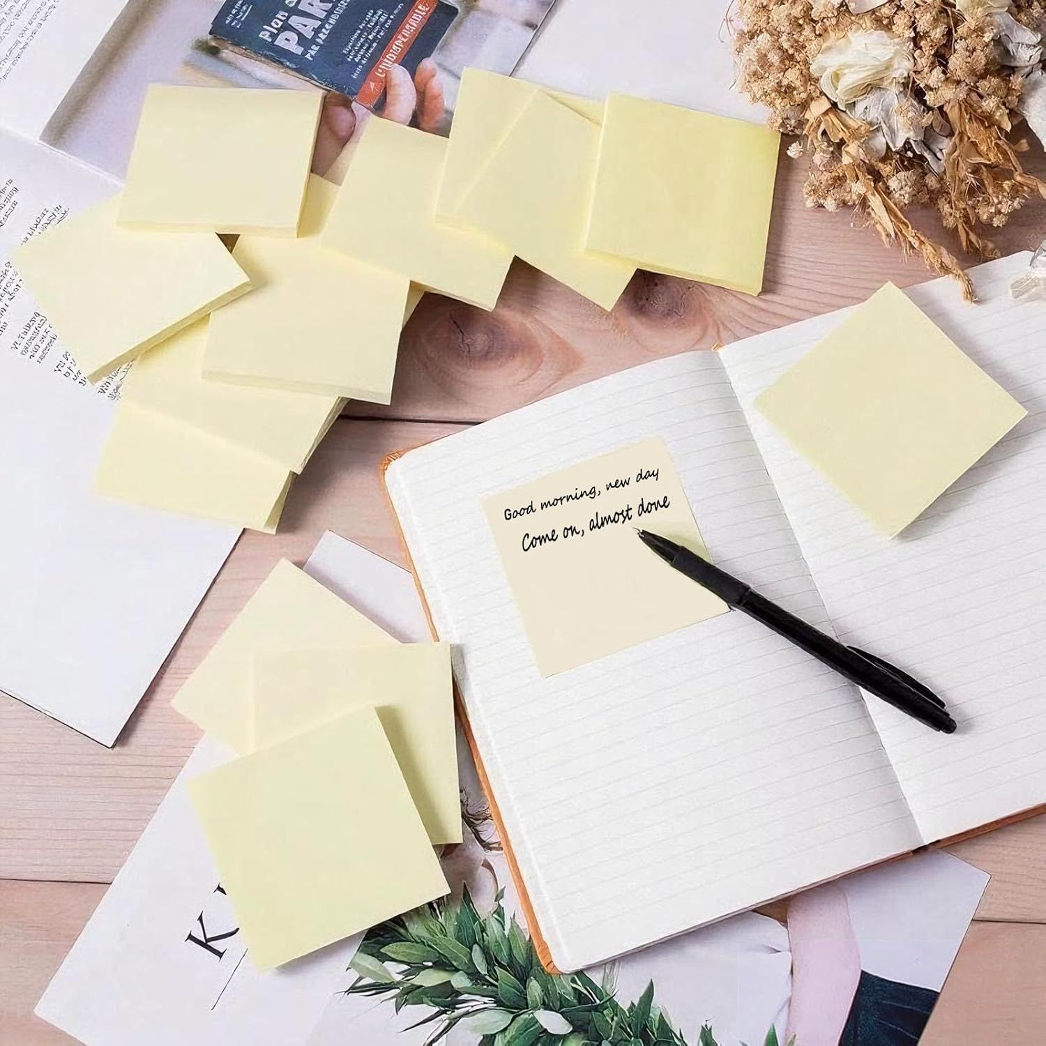 Demonstrates the product (sticky notes) in a natural, everyday use environment to help shoppers visualize how they would use the product in their own workspace or daily routine.