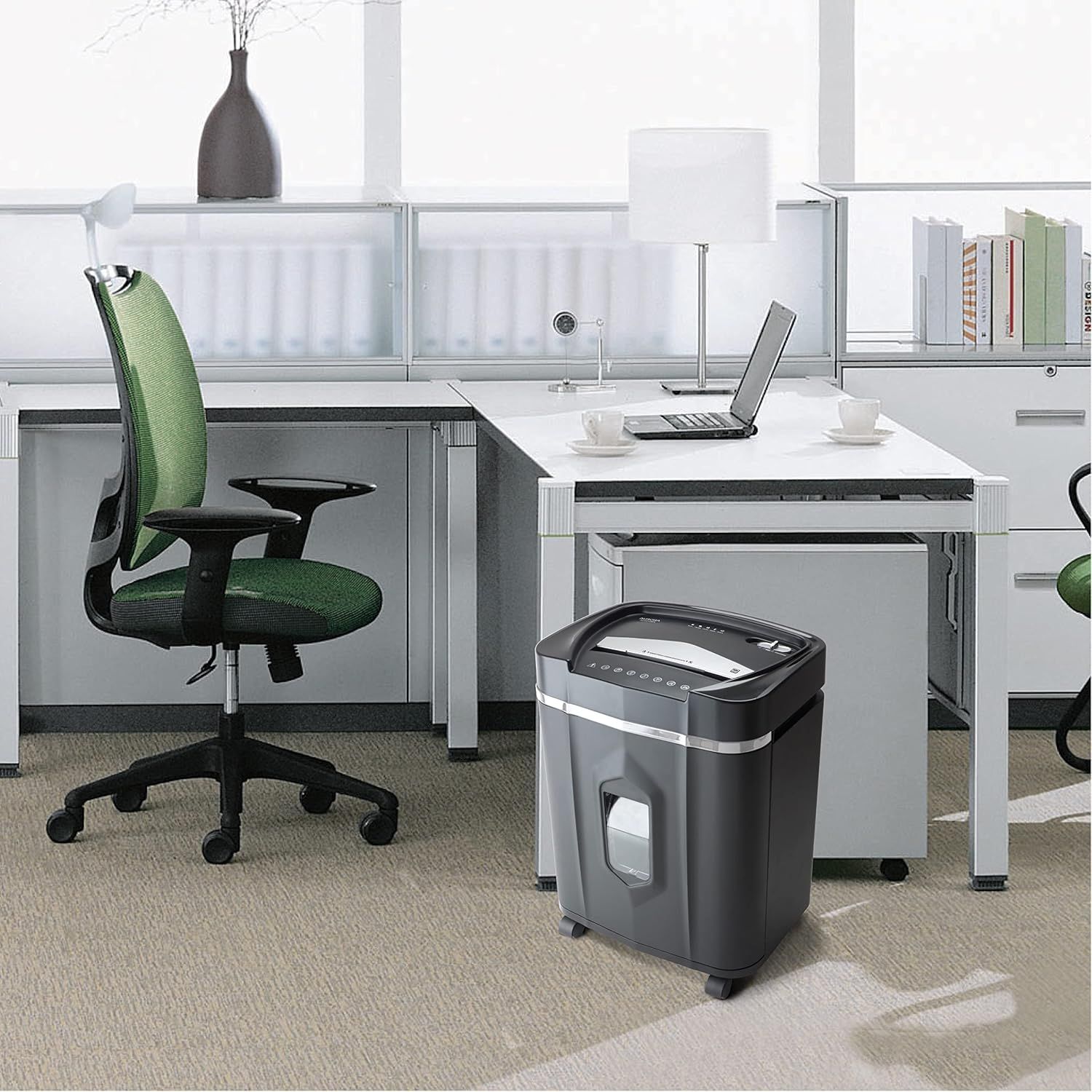 Demonstrates the product in a real-world office setting to help shoppers visualize how the paper shredder fits naturally into their workspace.