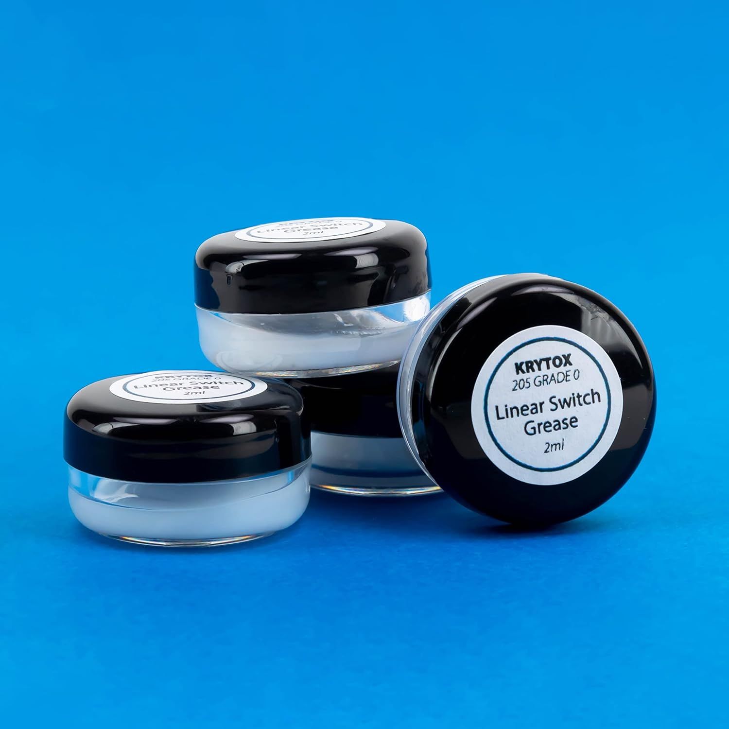 Displays the product clearly in a clean catalog-style format to show the physical appearance and packaging of the grease containers.