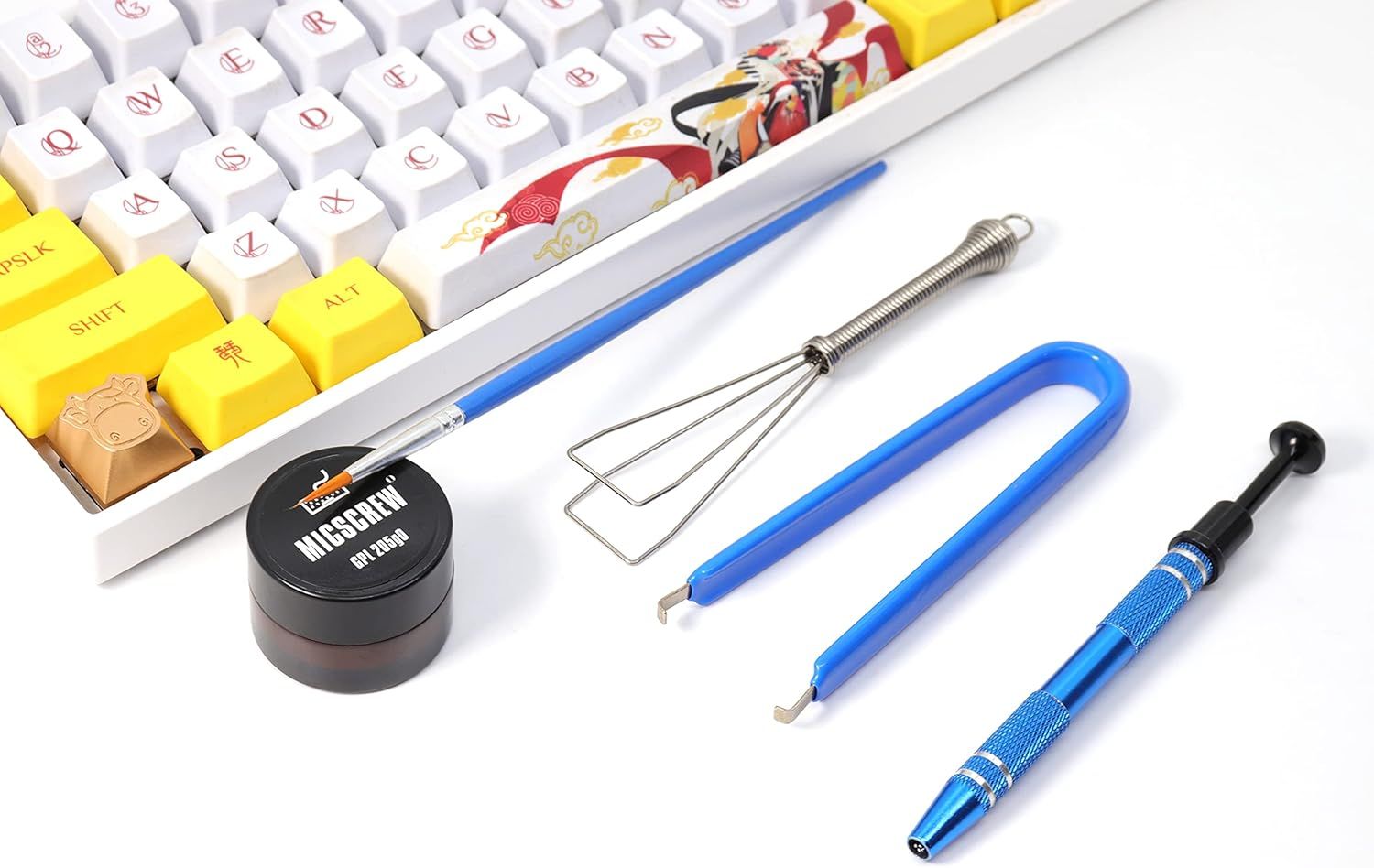 Shows all the tools and accessories included with the purchase, reassuring the shopper they have everything needed for keyboard maintenance and customization.