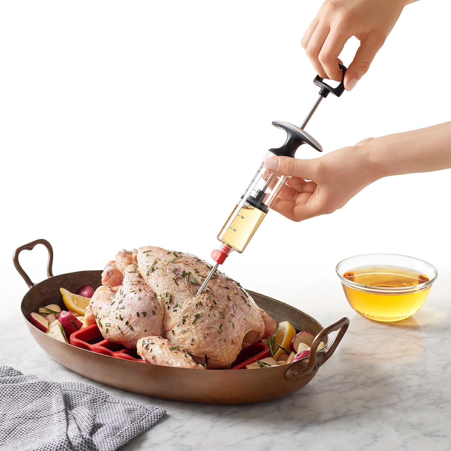 Demonstrates how to use the marinade injector to infuse flavor directly into meat, showing the proper technique and application method. Highlights the product's ability to inject marinades and…