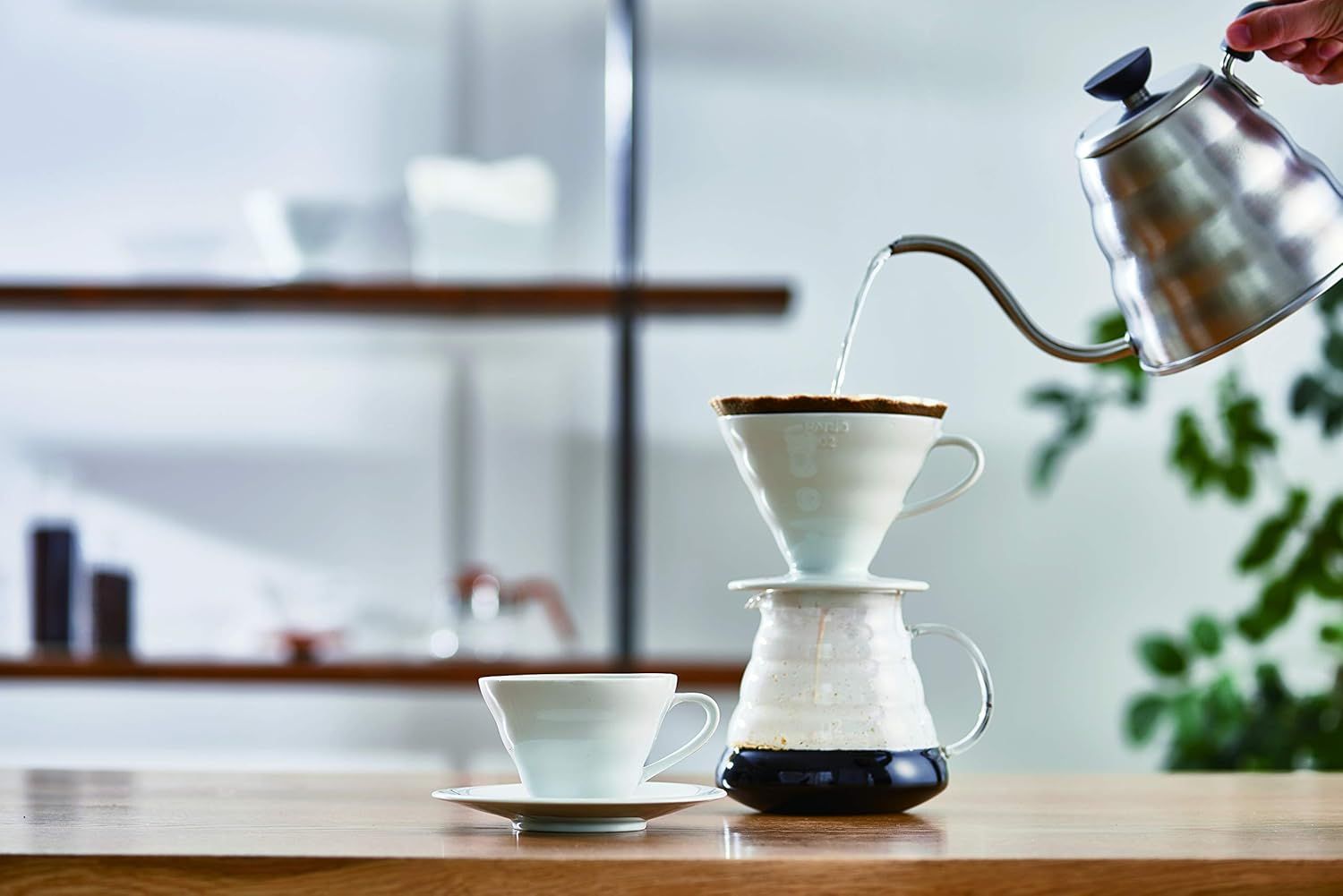 Showcases the product in an authentic, real-world kitchen environment to help shoppers visualize the coffee brewing experience in their own home.