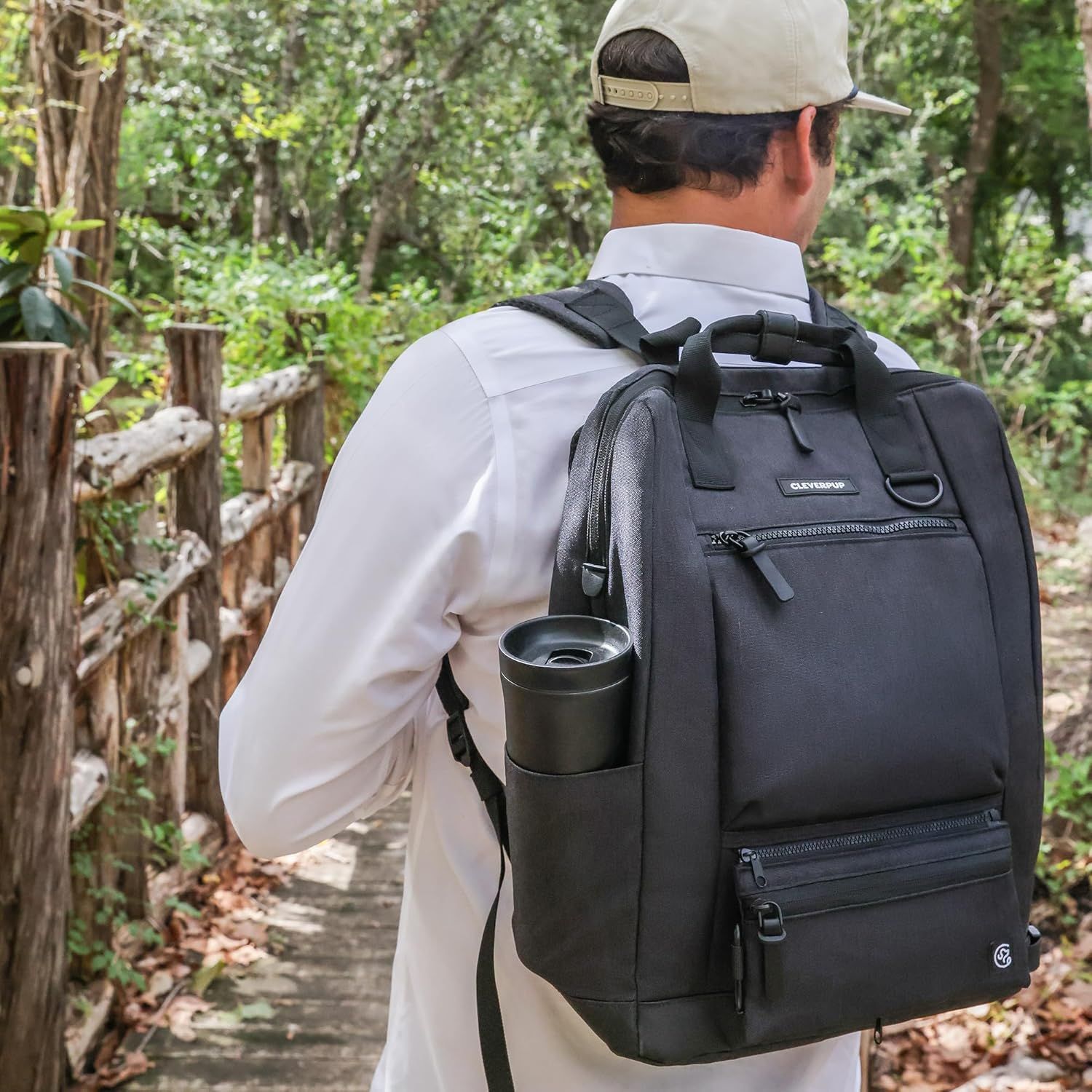 Demonstrates the backpack in an outdoor hiking context, showing its suitability for active pet owners on trails and outdoor adventures.
