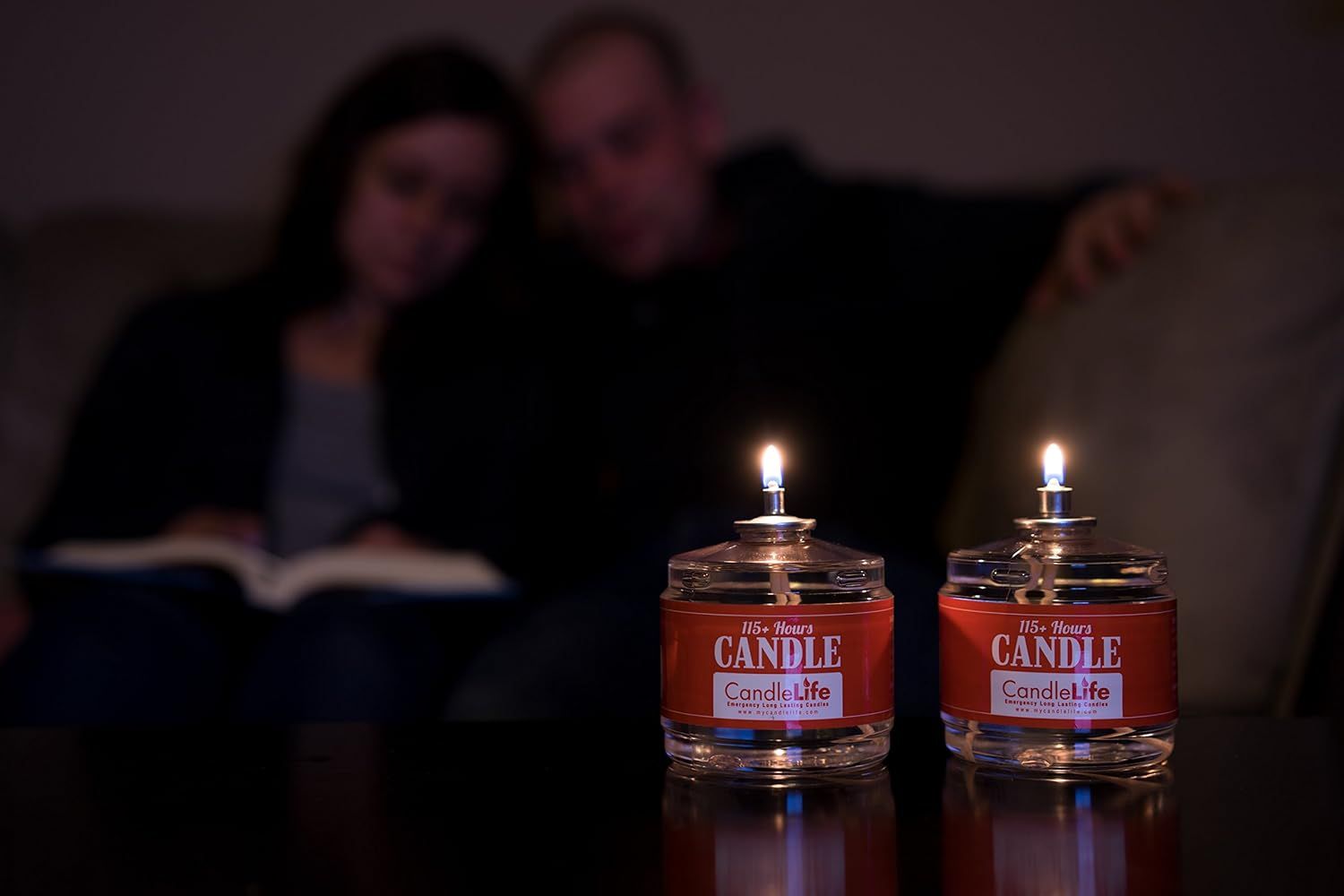 Depicts the candles in use within a cozy home environment with people in the background to help shoppers envision the product creating ambiance in their own living spaces.