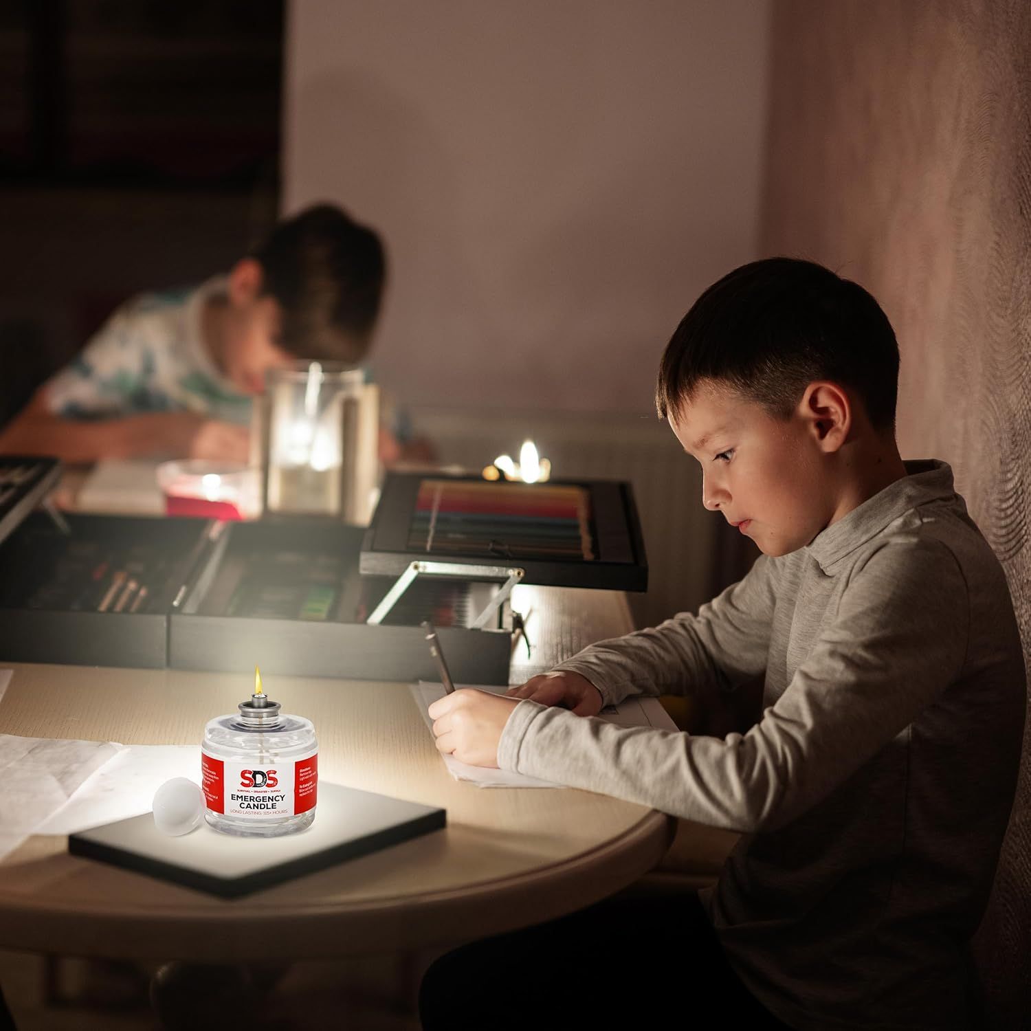 Demonstrates the product in a real-world power outage scenario, showing children using the candle for light during homework or activities.