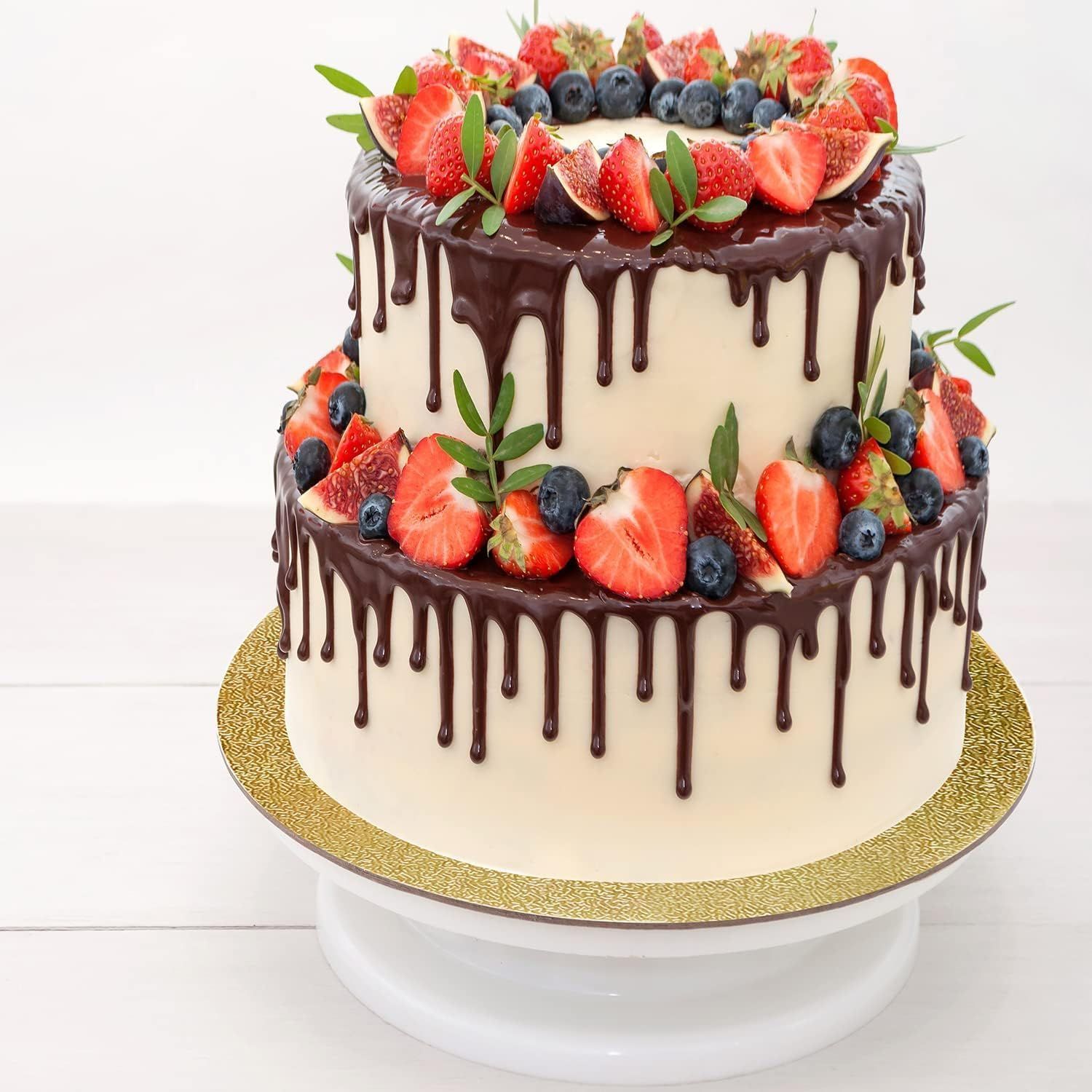 Shows the product in use with an elegant tiered cake, demonstrating its ability to enhance cake presentation.