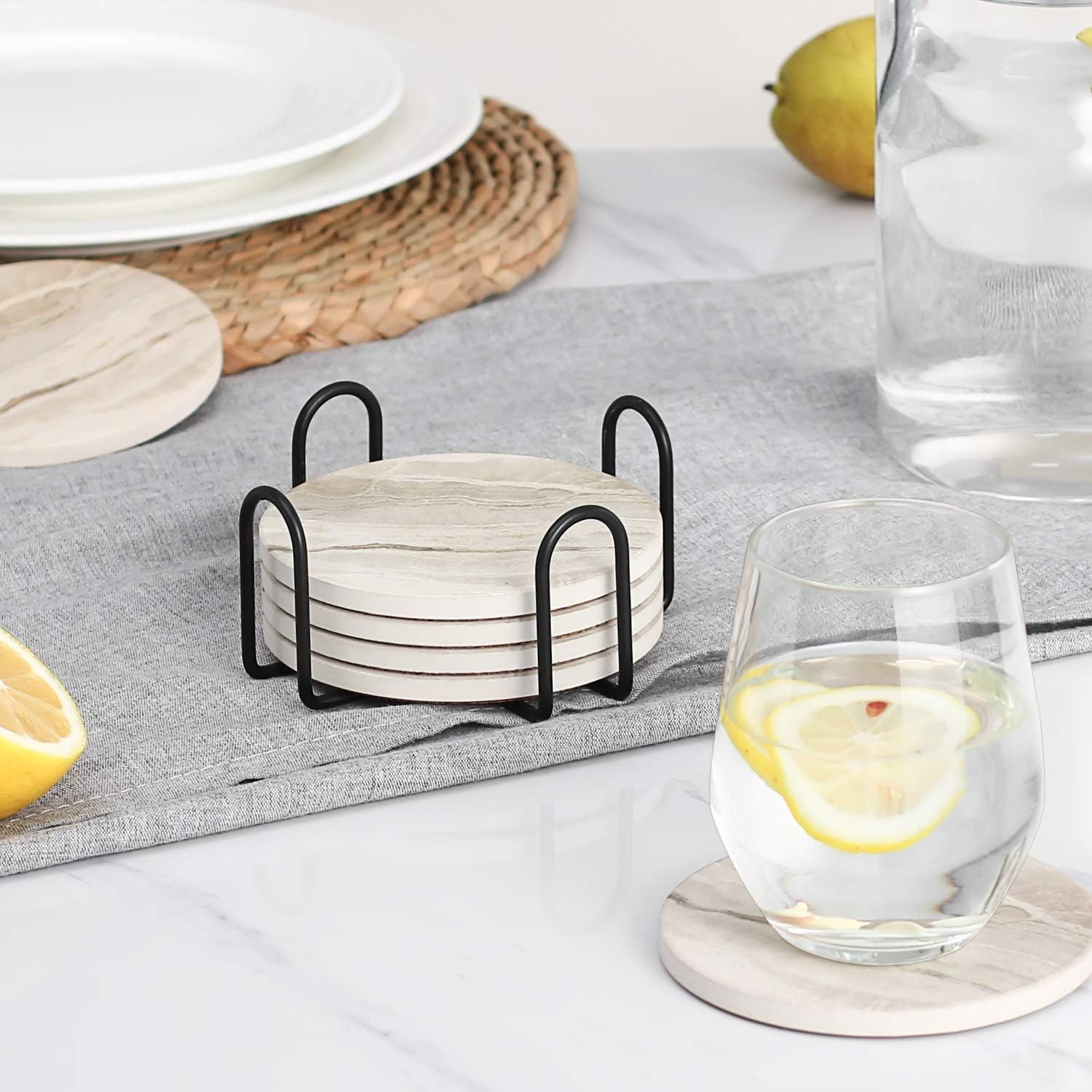 Shows the coasters and holder in a dining environment to demonstrate how they integrate into everyday table settings.