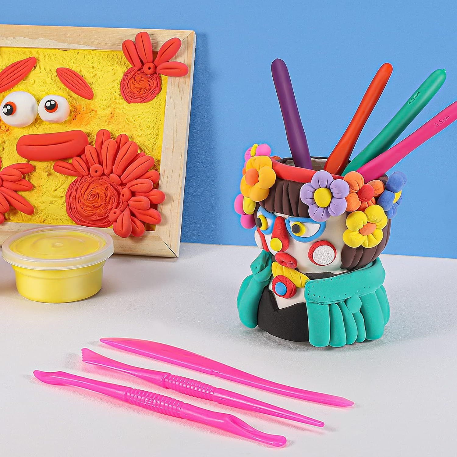 Shows the product in use with finished clay creations to inspire shoppers and demonstrate the creative possibilities.