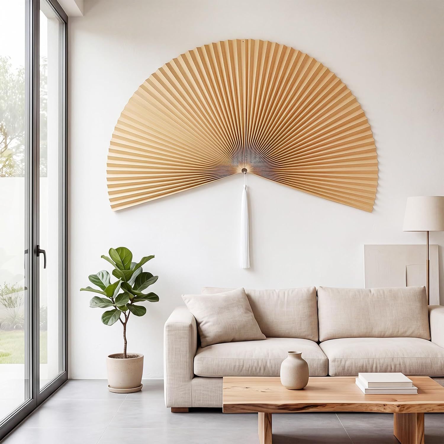 Shows the wall fan displayed above a contemporary sofa in a bright, modern living space to help shoppers visualize the product's aesthetic appeal in their home.