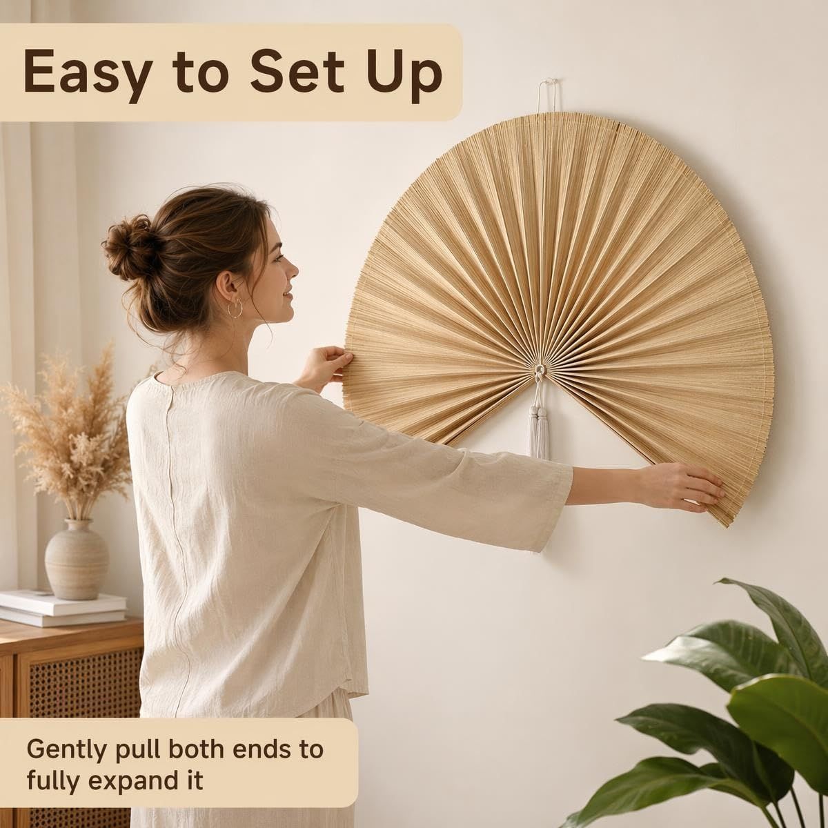 Demonstrates how simple it is to set up the wall decor by showing a person expanding it, reassuring shoppers about ease of installation. Highlights the convenience and simplicity of setting up the…