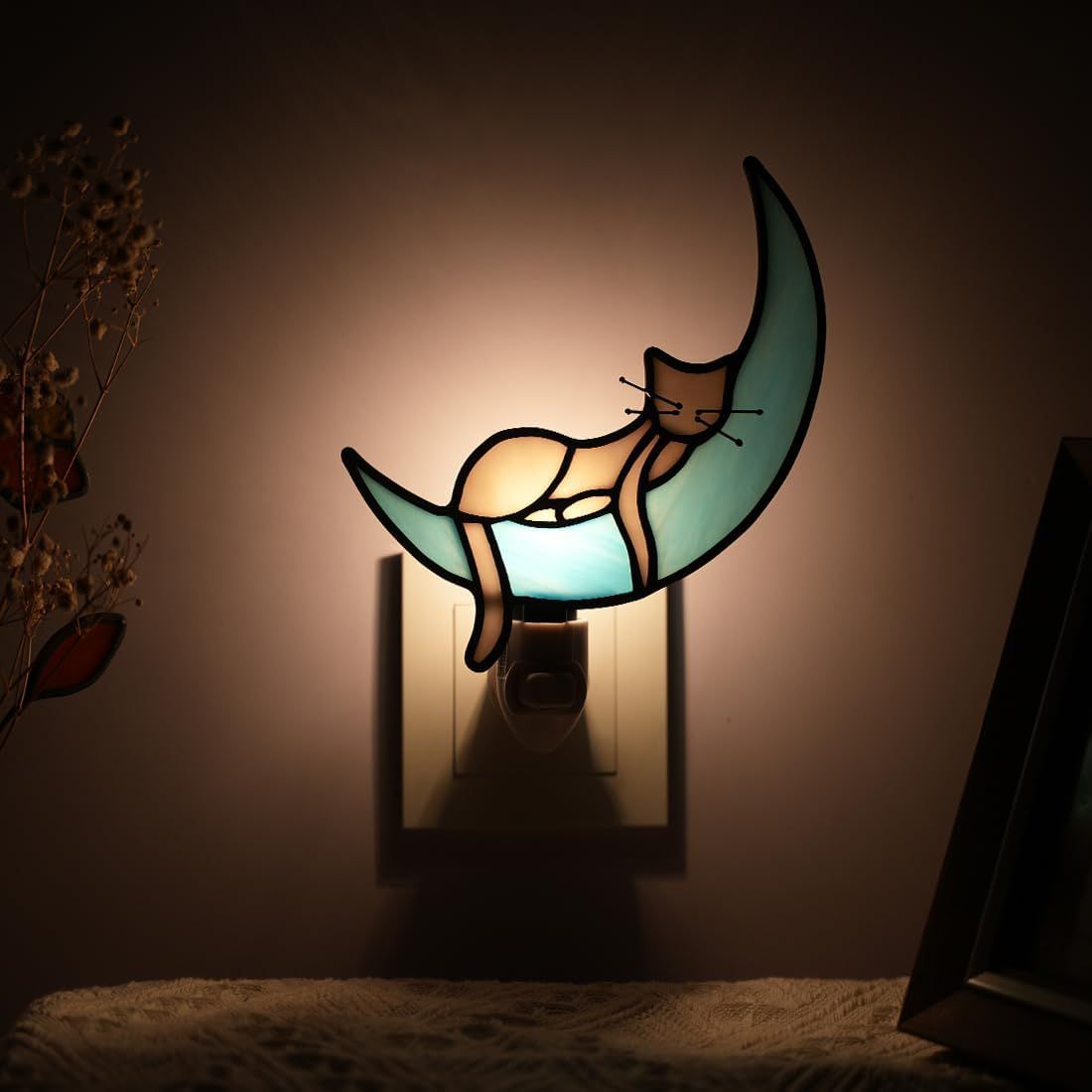 Shows the nightlight in a real-world home setting to help shoppers visualize how it looks when illuminated on a wall.