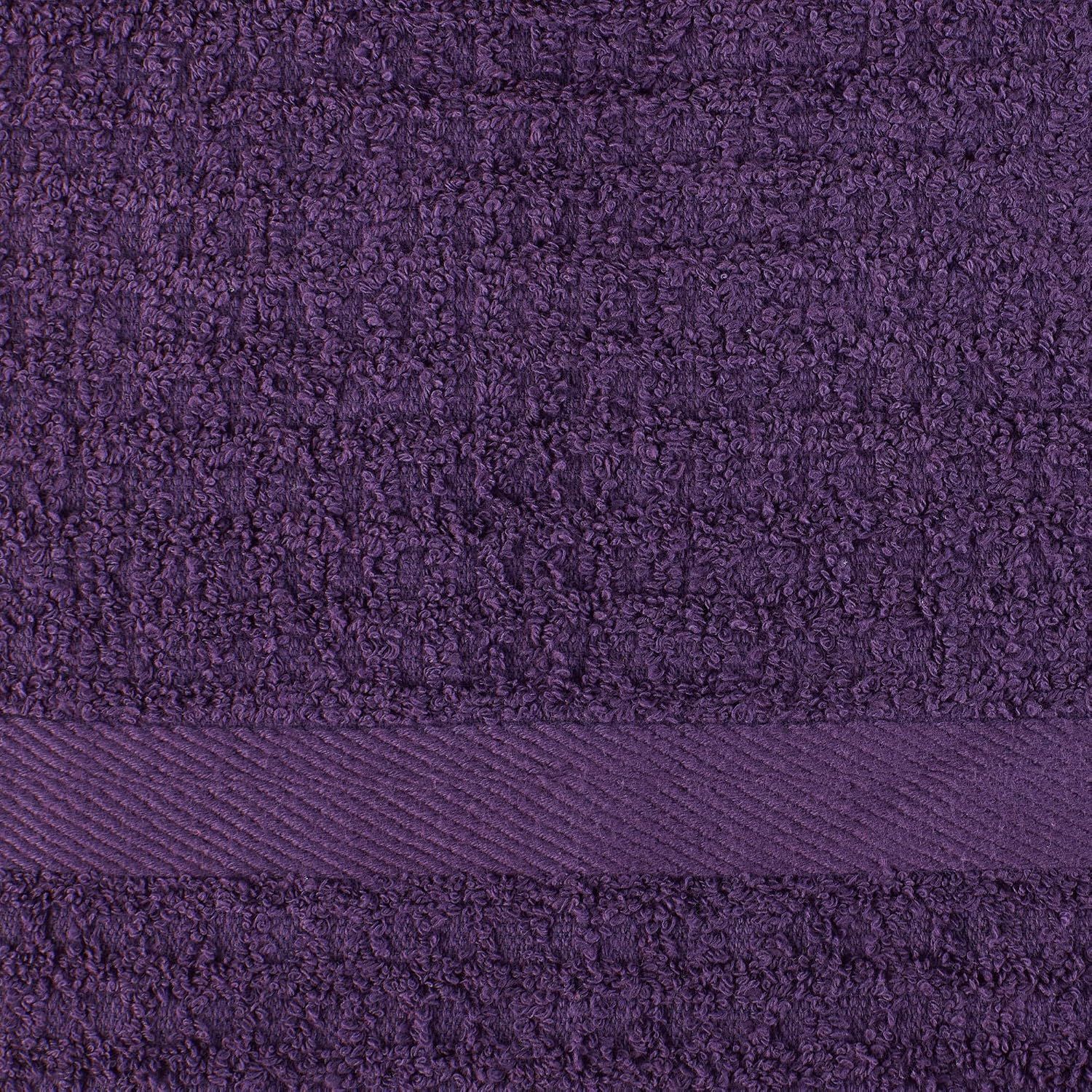 Close-up white background shot highlighting the towel's textured weave and decorative band detail.