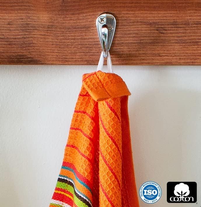 Displays certification logos (ISO and Cotton) to reassure shoppers that the product meets quality and sustainability standards. Shows the towel hanging in a real-world kitchen setting to help…