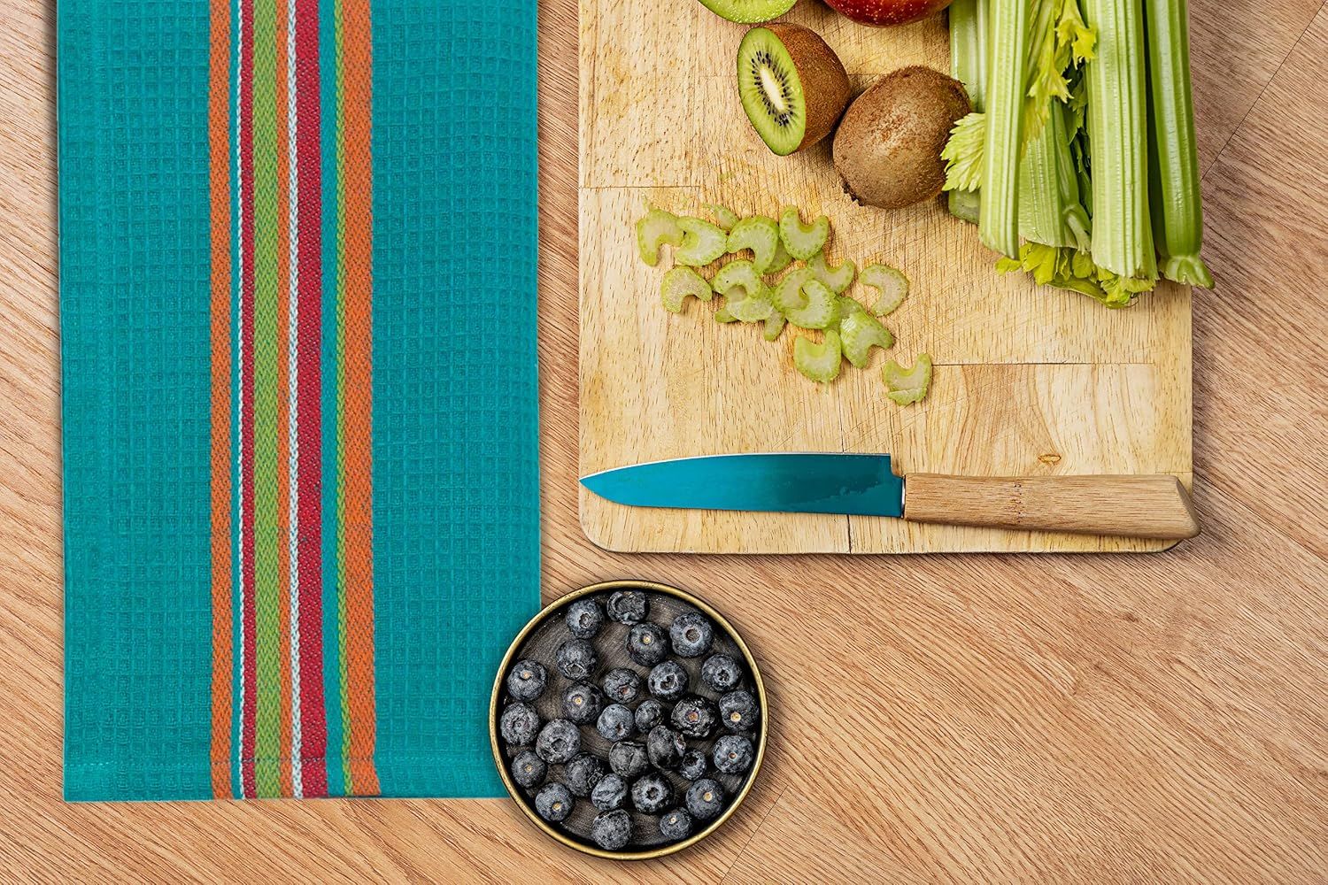 Shows the towel in a kitchen food prep setting with fresh ingredients, helping shoppers visualize the product in everyday use.