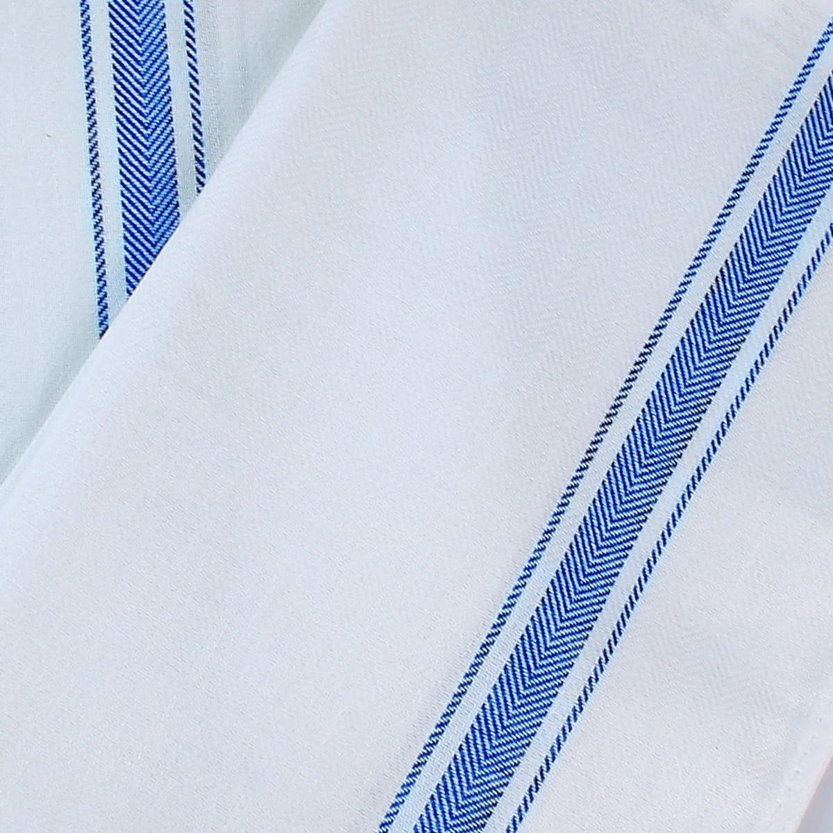 Highlights the herringbone weave pattern and fabric texture to communicate the quality and craftsmanship of the material.
