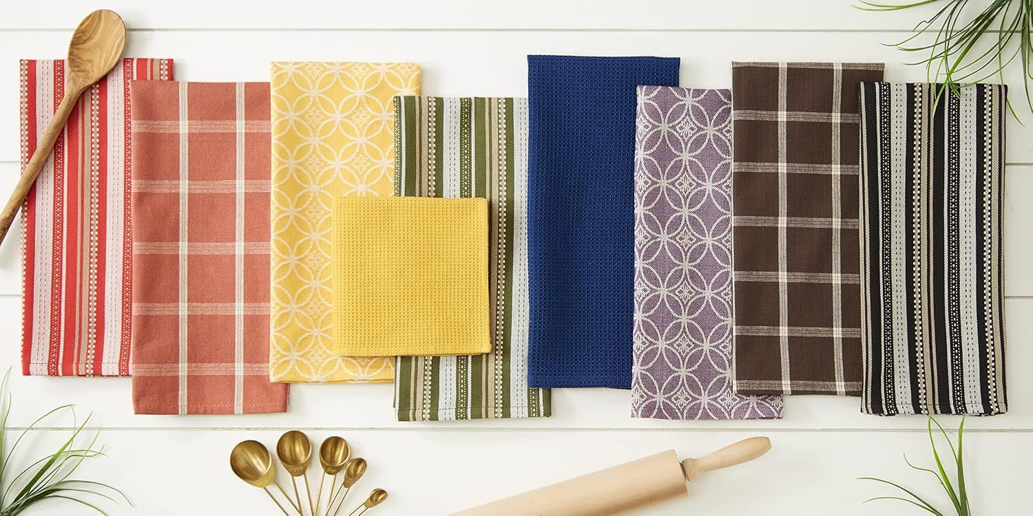 Displays the full range of color and pattern options available in the brand's dishtowel collection to help shoppers choose their preferred style.