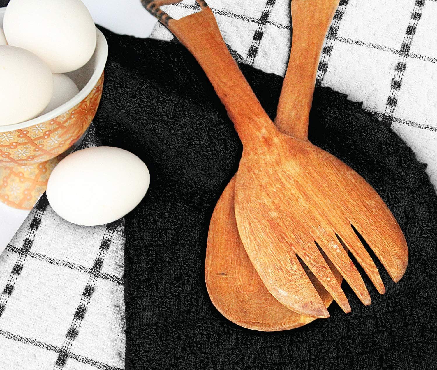 Displays the kitchen towel in a styled kitchen environment with wooden utensils and eggs to demonstrate real-world usage and aesthetic appeal.