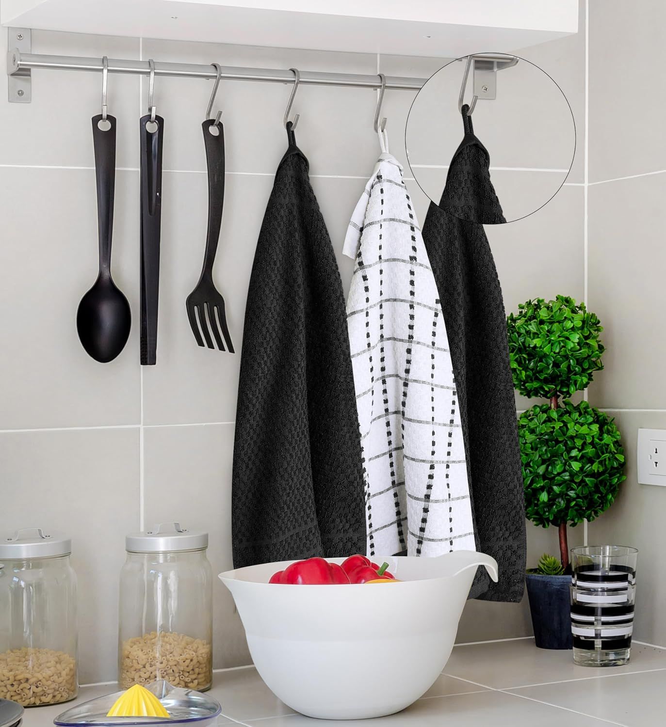 Demonstrates the towels hanging in a kitchen environment with a loop feature highlighted to show practical storage and usage in a real-world setting.