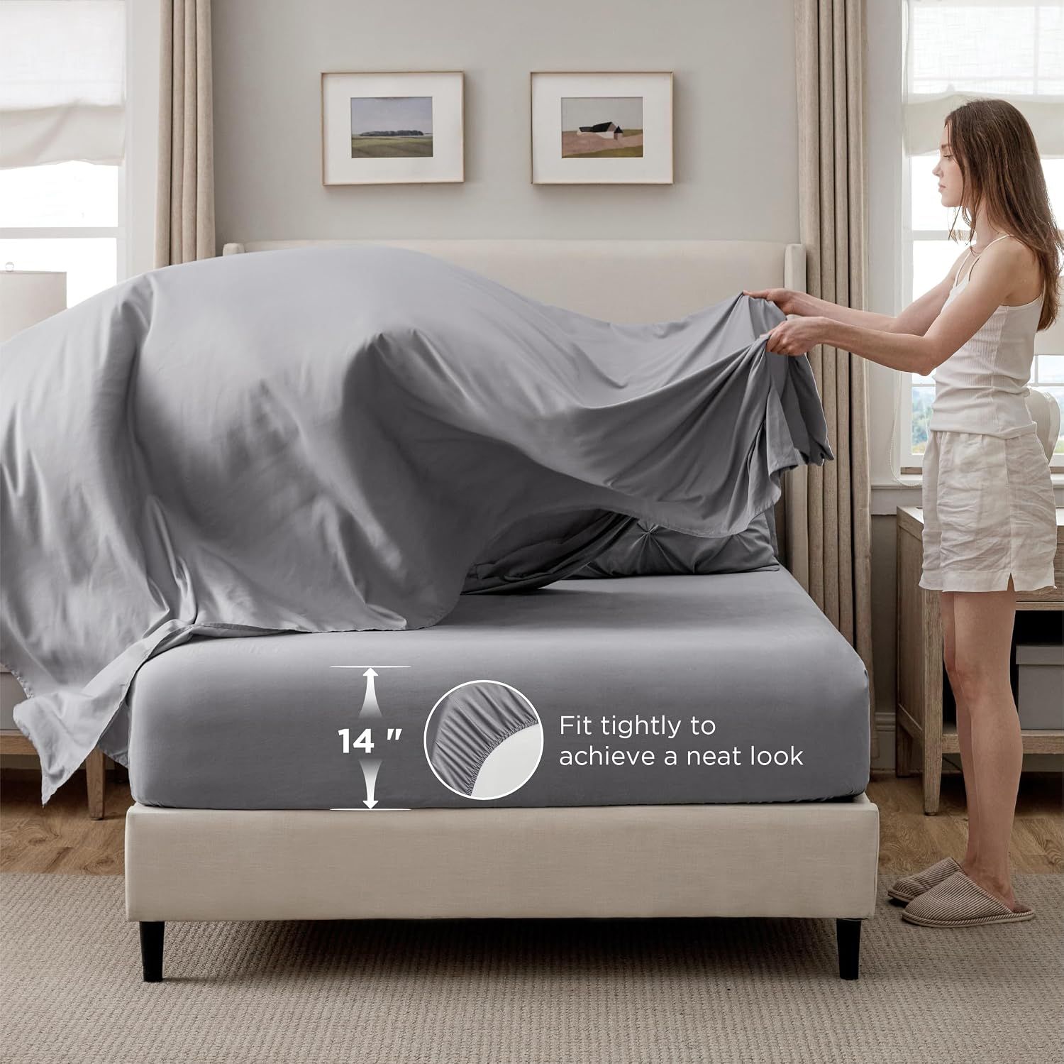 Shows the fitted sheet's 14-inch depth capacity with visual measurement to help shoppers confirm compatibility with their mattress size.