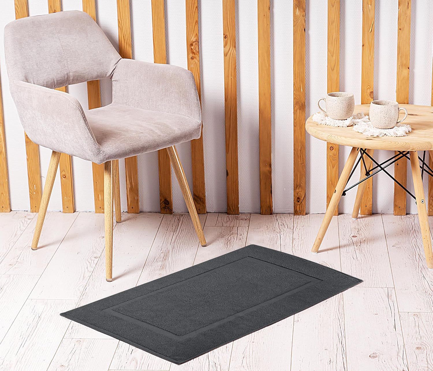 Demonstrates how the bath mat fits into a styled home environment with furniture and decor, showing its aesthetic appeal.