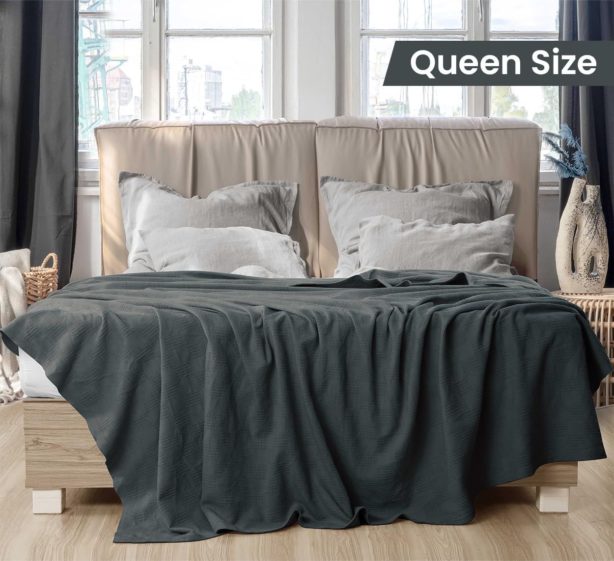 Displays the blanket on a queen-size bed with a clear 'Queen Size' label to help shoppers understand the physical dimensions and coverage area of the product.