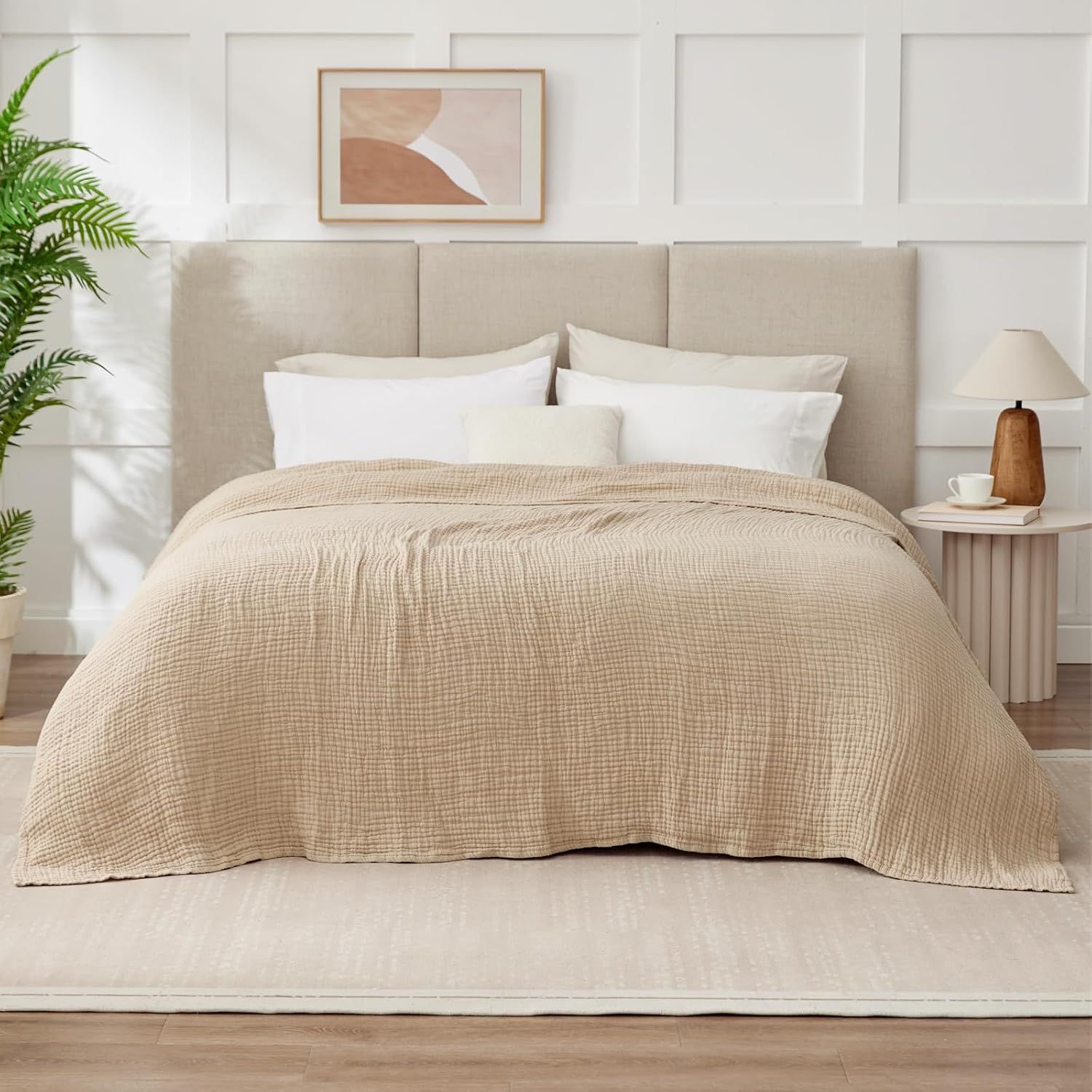 Presents the blanket in a styled bedroom to help shoppers visualize its appearance and fit in their own home.
