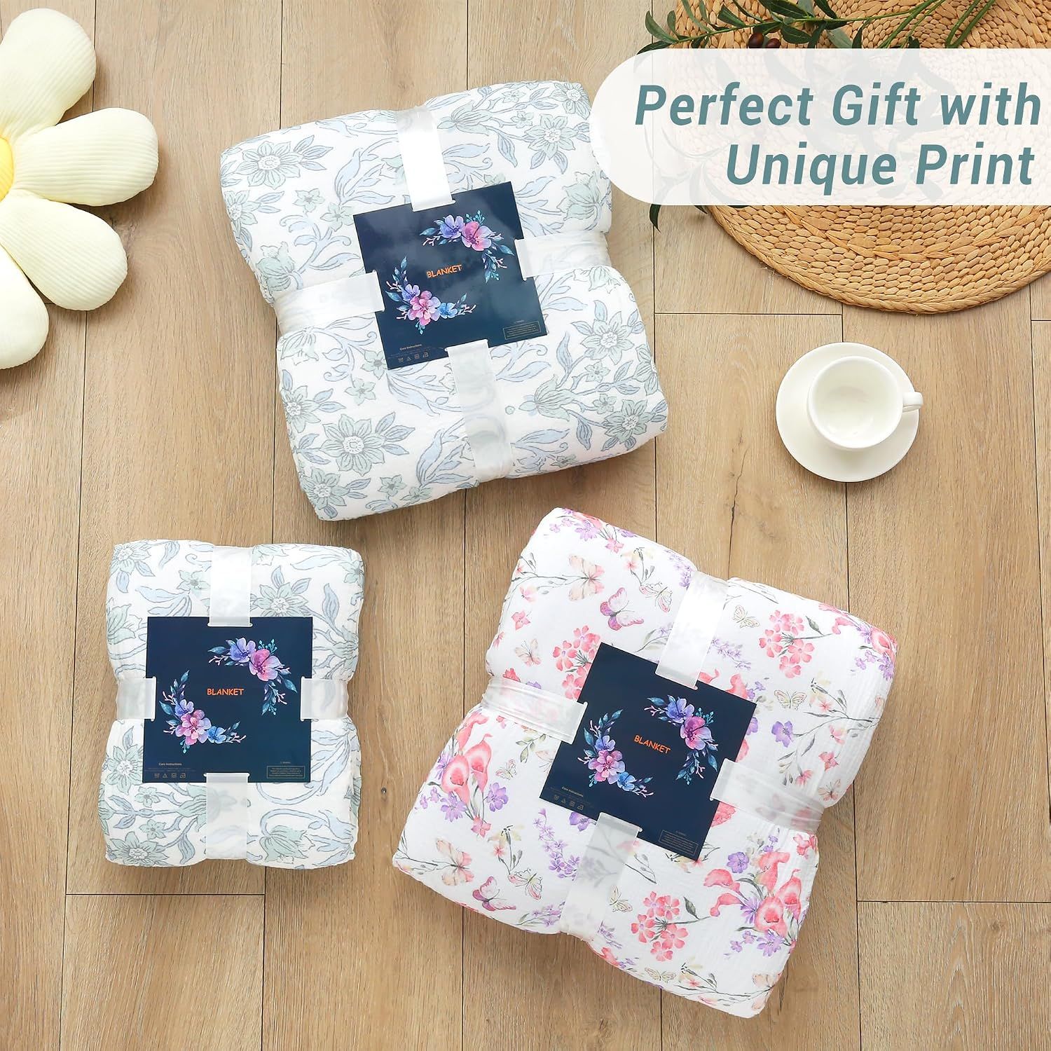 Positions the blanket as a perfect gift option by showing multiple folded blankets with decorative packaging labels, appealing to gift-giving occasions.