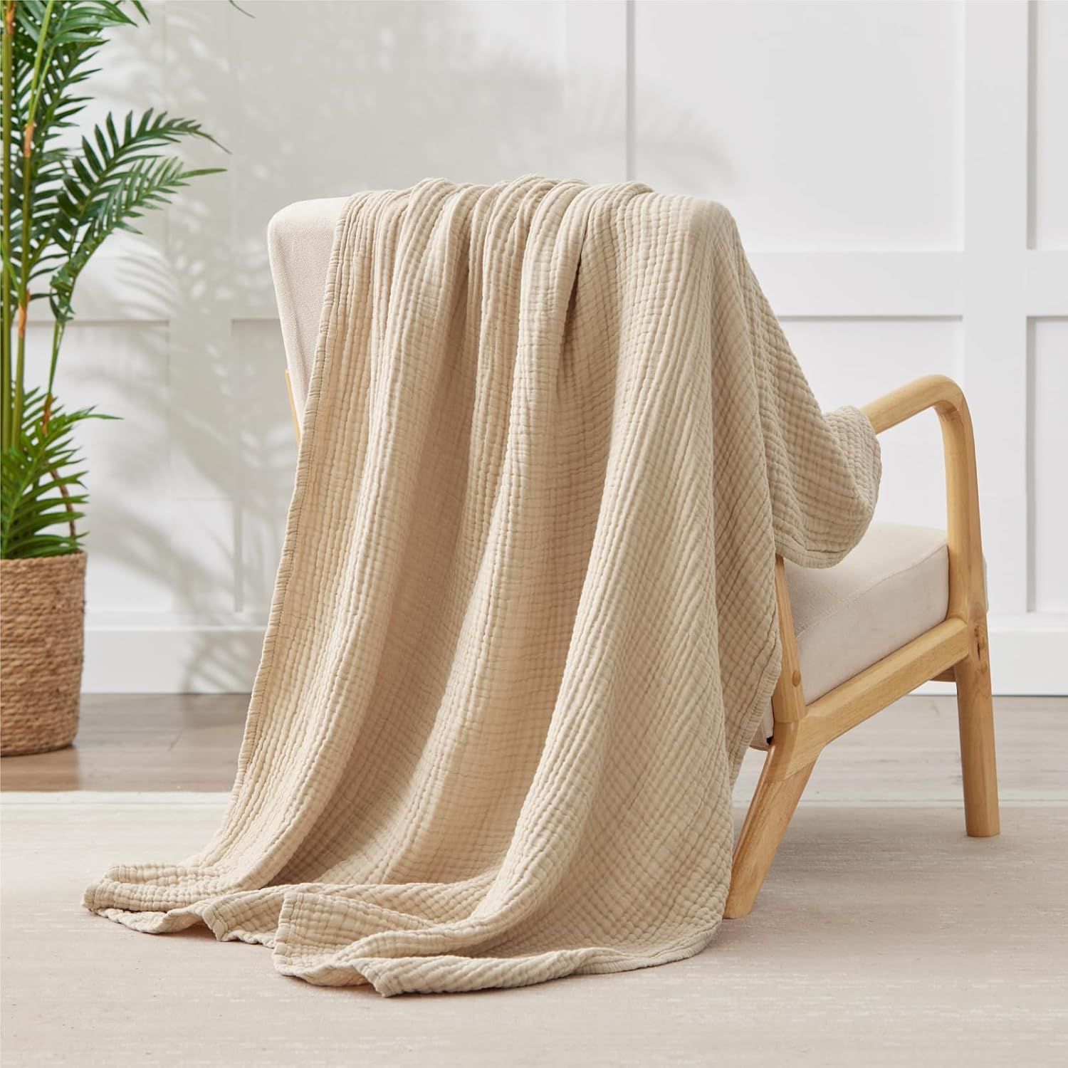 Shows the blanket draped over a chair to demonstrate its versatility and texture in a living space.