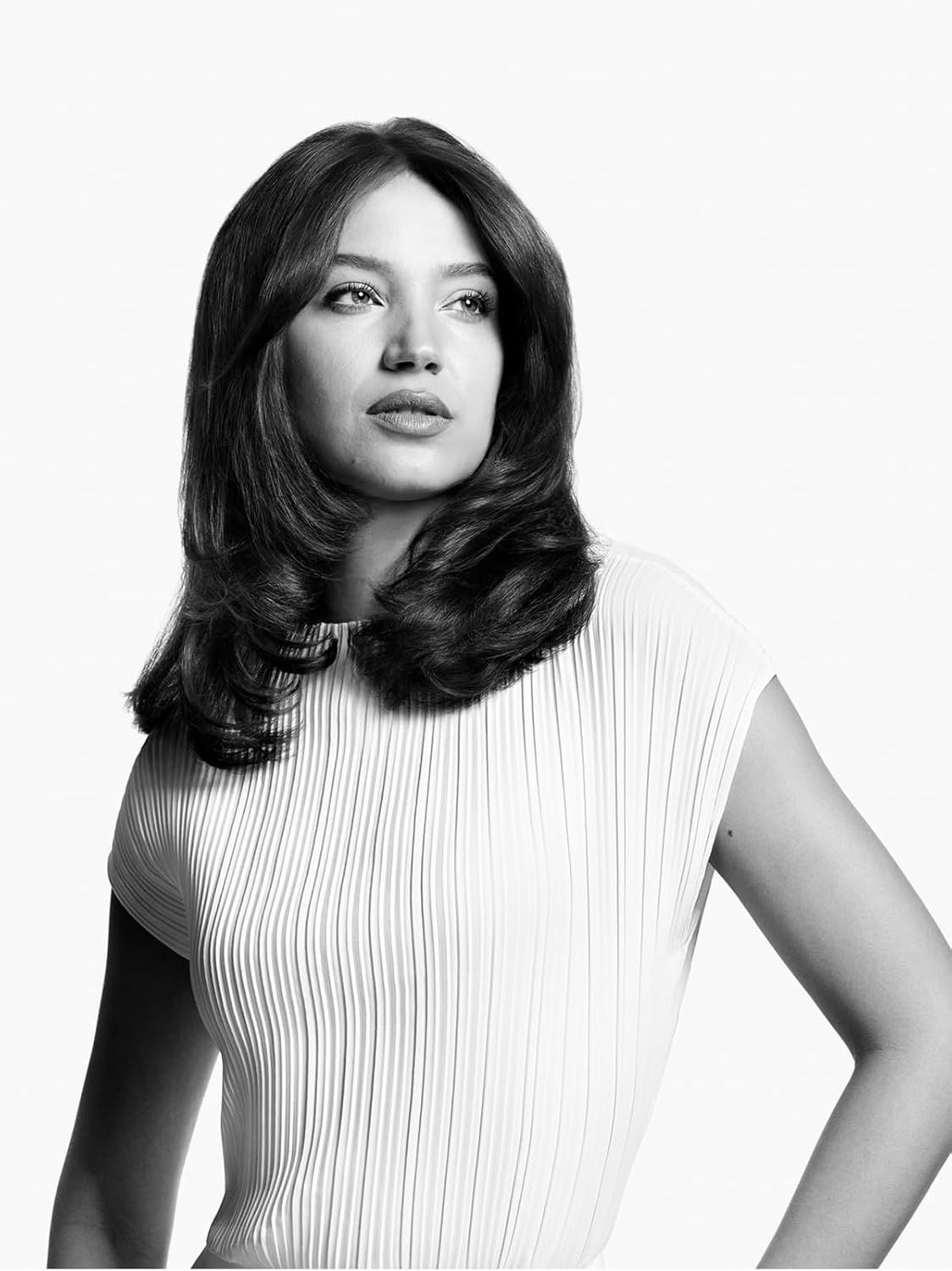 Demonstrates the hair transformation achieved with the product, showing enhanced volume and curl to prove styling effectiveness.