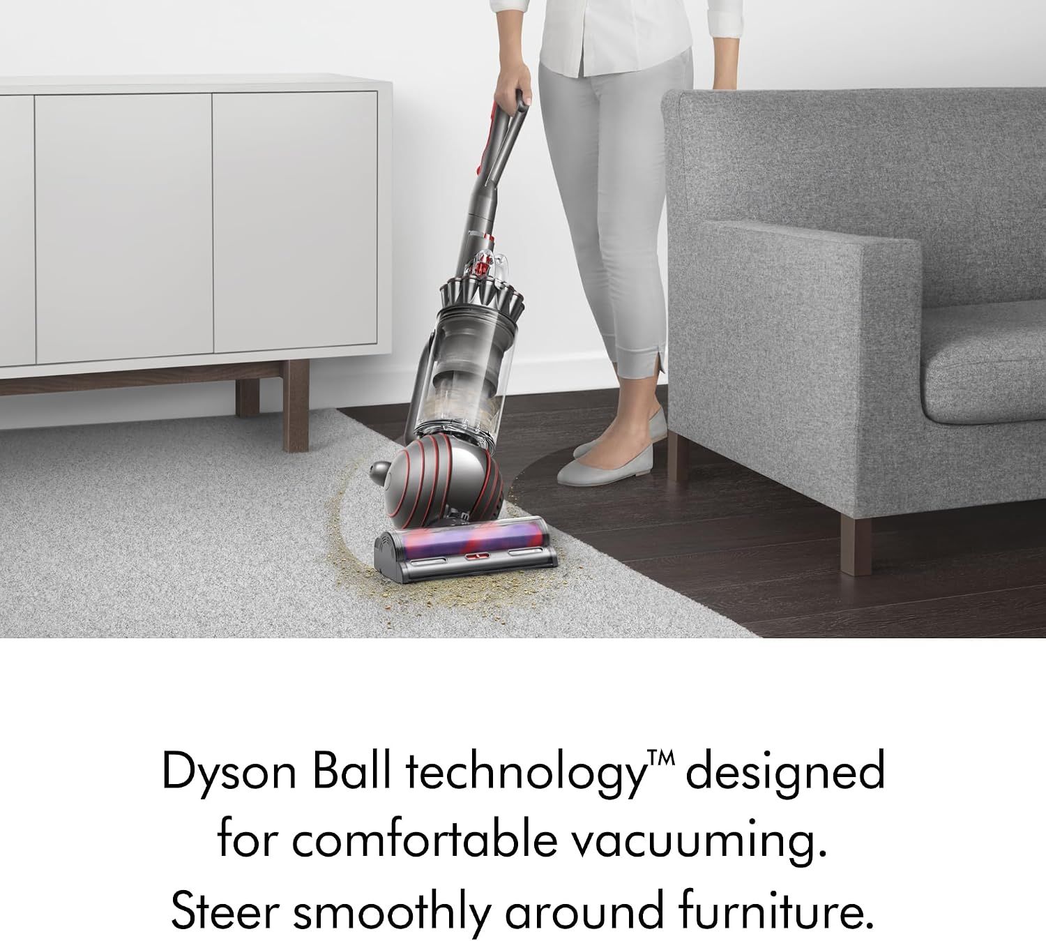 Demonstrates the Dyson Ball technology that enables comfortable vacuuming and smooth steering around furniture, emphasizing ease of use and maneuverability.