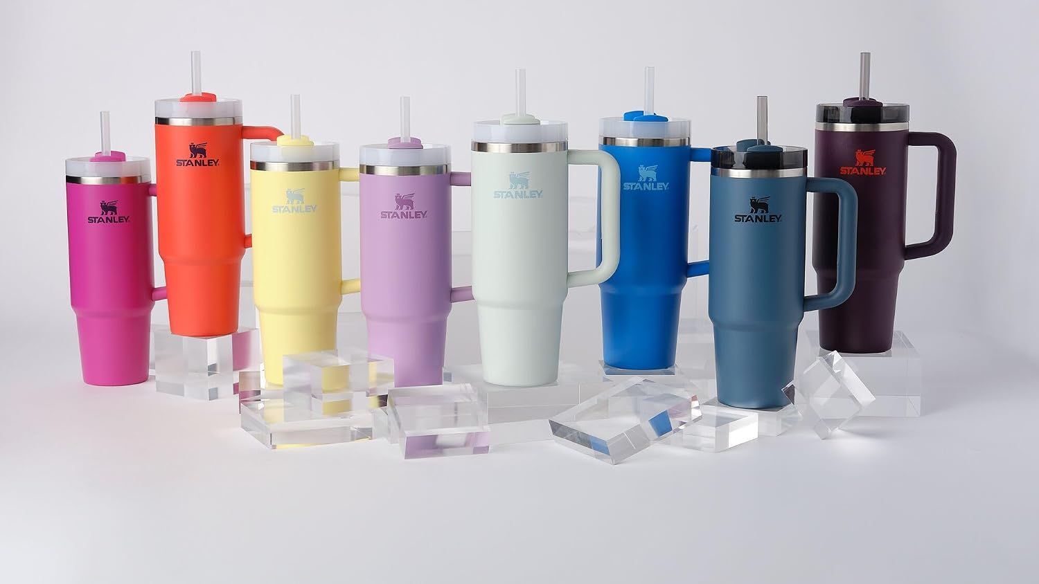 Displays the full range of color options available in the Stanley tumbler line, helping shoppers visualize the variety and choose their preferred color.