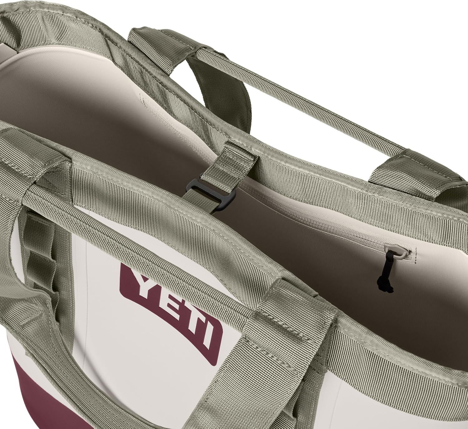 Shows a close-up detail of the bag's handles and interior sleeve on a clean white background with no text or design elements.