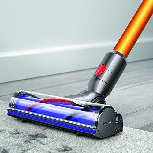 Shows the vacuum's floor cleaning head in action on a hard floor surface, demonstrating real-world usage without text or callouts.