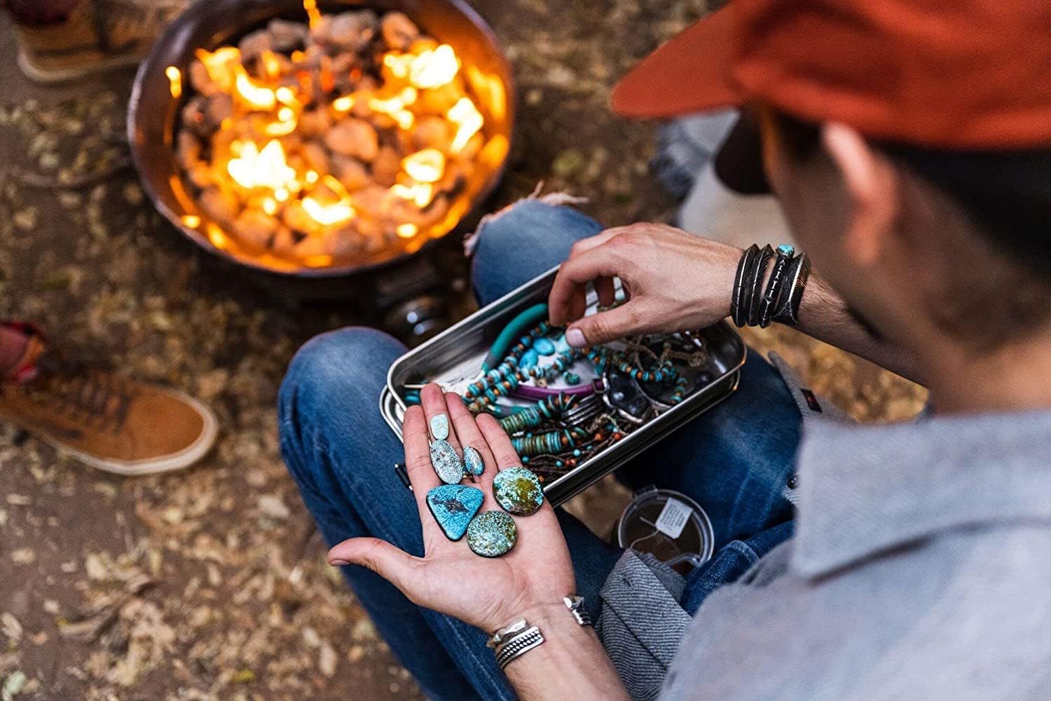 Demonstrates the product being used to store jewelry and small items in an outdoor camping setting, showing versatility without text.