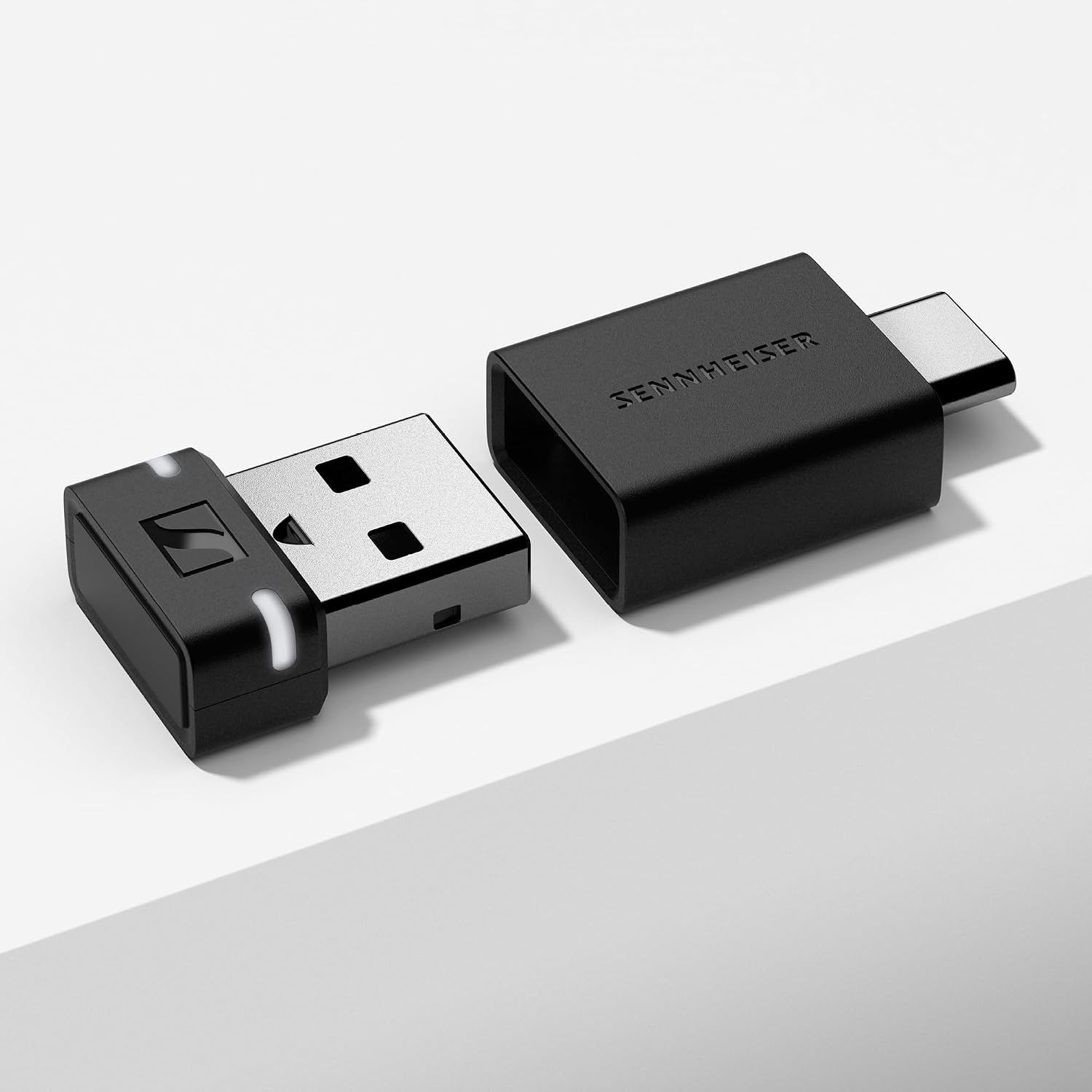 Shows the dongle and USB-C adapter clearly on a plain background so shoppers can see what is included.