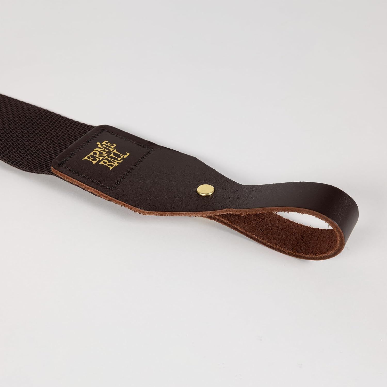 Shows the strap close up on a plain light background so shoppers can judge the material and hardware quality.