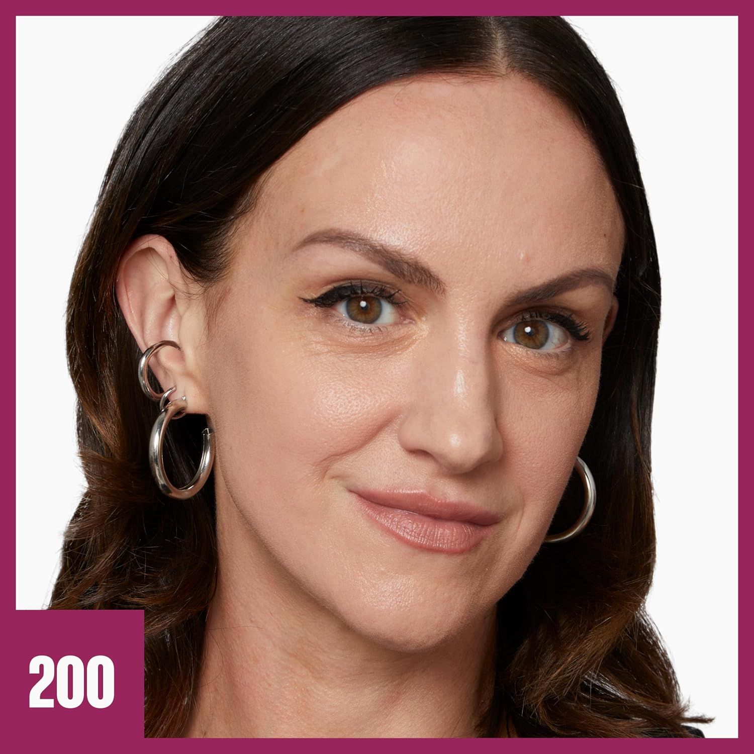 A clean close-up of a model in shade 200 shows how the foundation looks on skin without retouching.